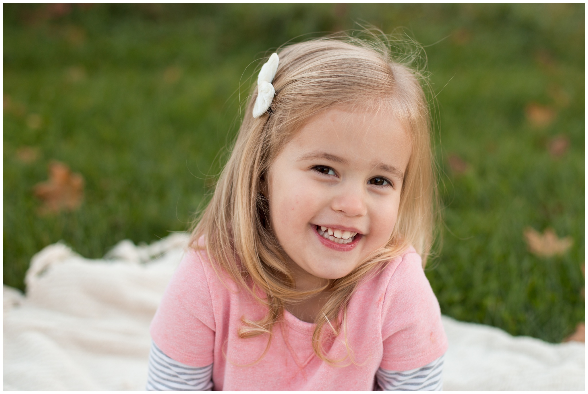 little girl grinning during family portraits in Kokomo, Indiana