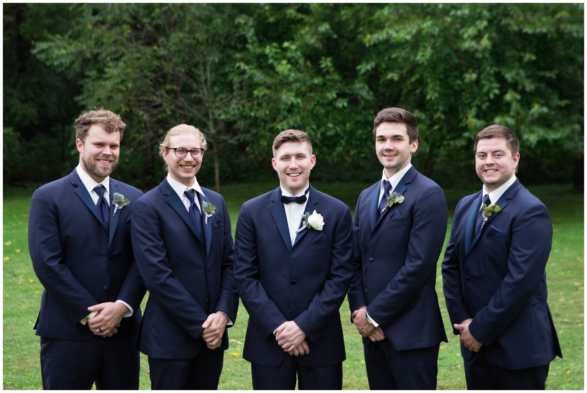 groom and groomsmen posing during portraits at The Lodge at River Valley Farm in Yorktown Indiana