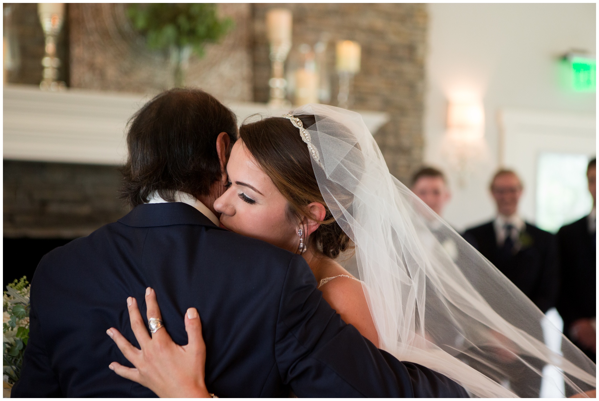 bride hugs father during wedding at the Lodge at River Valley Farm in Yorktown Indiana