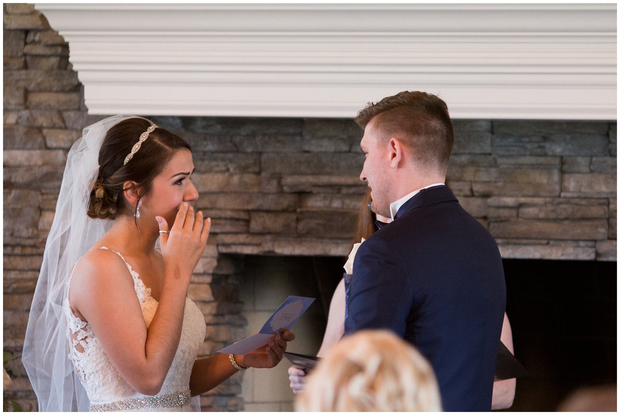 bride wipes tears during wedding ceremony at the Lodge at River Valley Farm in Yorktown Indiana