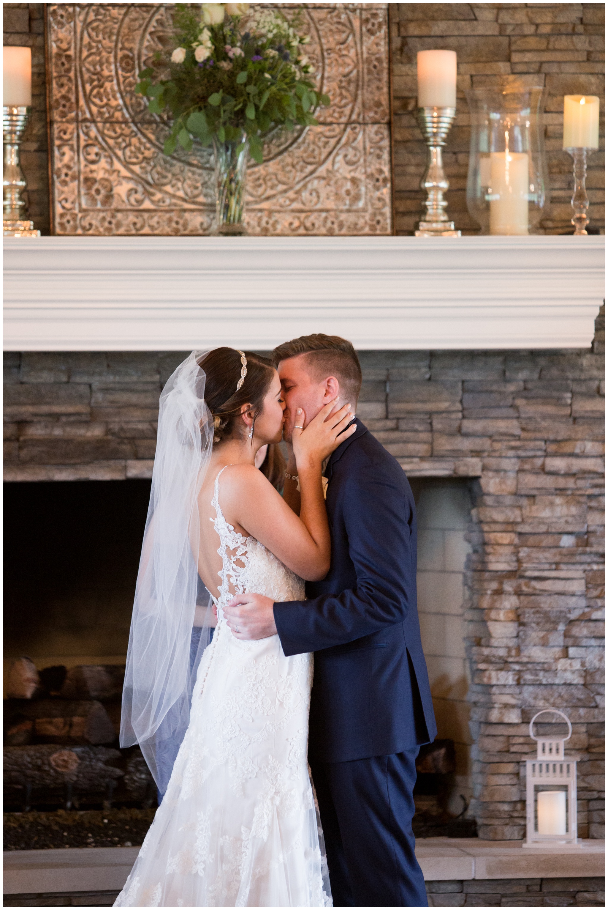 bride and groom's first kiss during wedding ceremony at the Lodge at River Valley Farm in Yorktown Indiana
