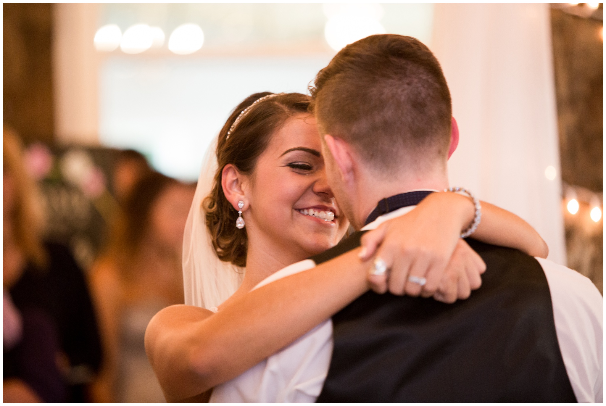 bride smiling during first dance at the Lodge at River Valley Farm in Yorktown Indiana