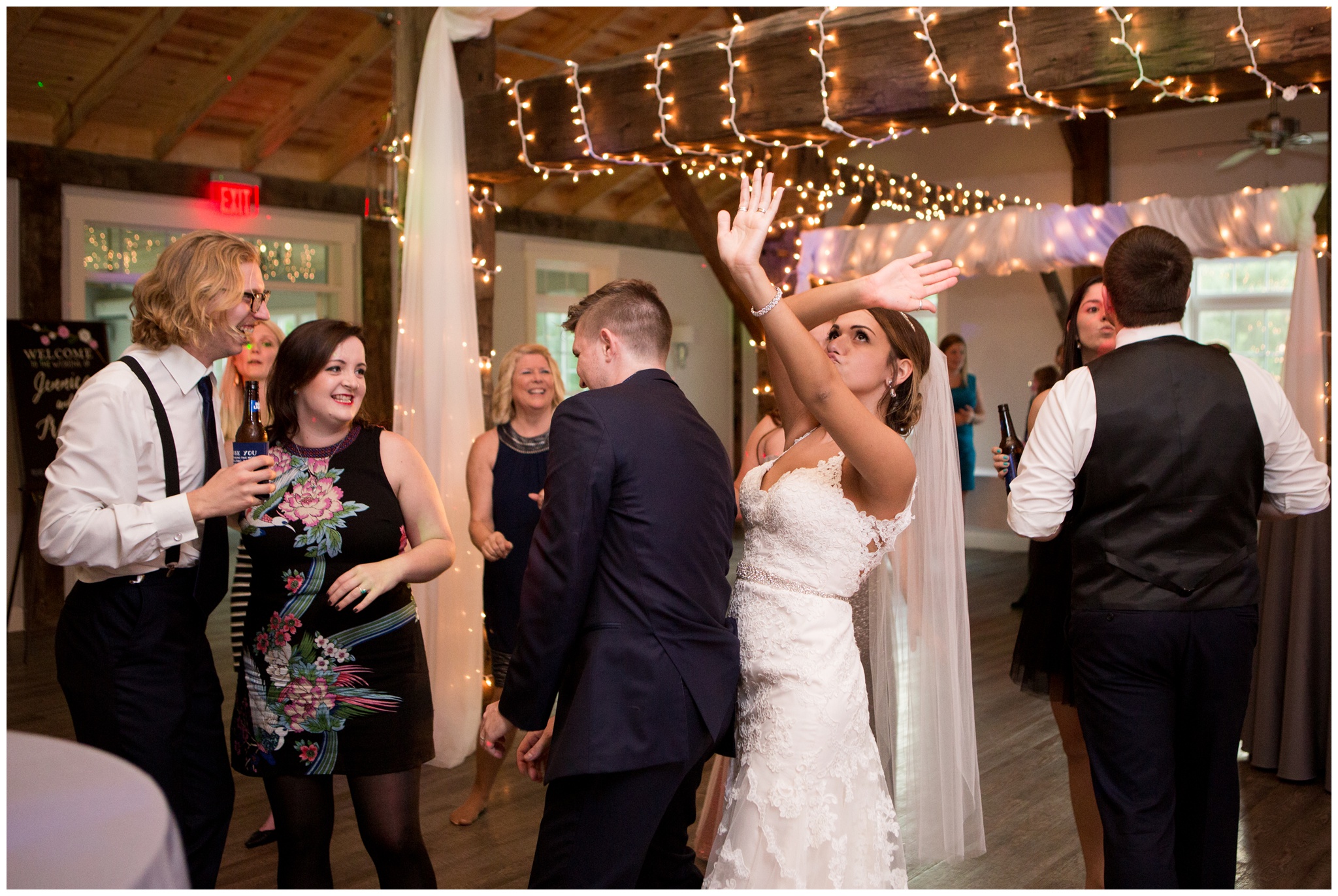 bride and groom dance with friends at reception at the Lodge at River Valley Farm in Yorktown Indiana