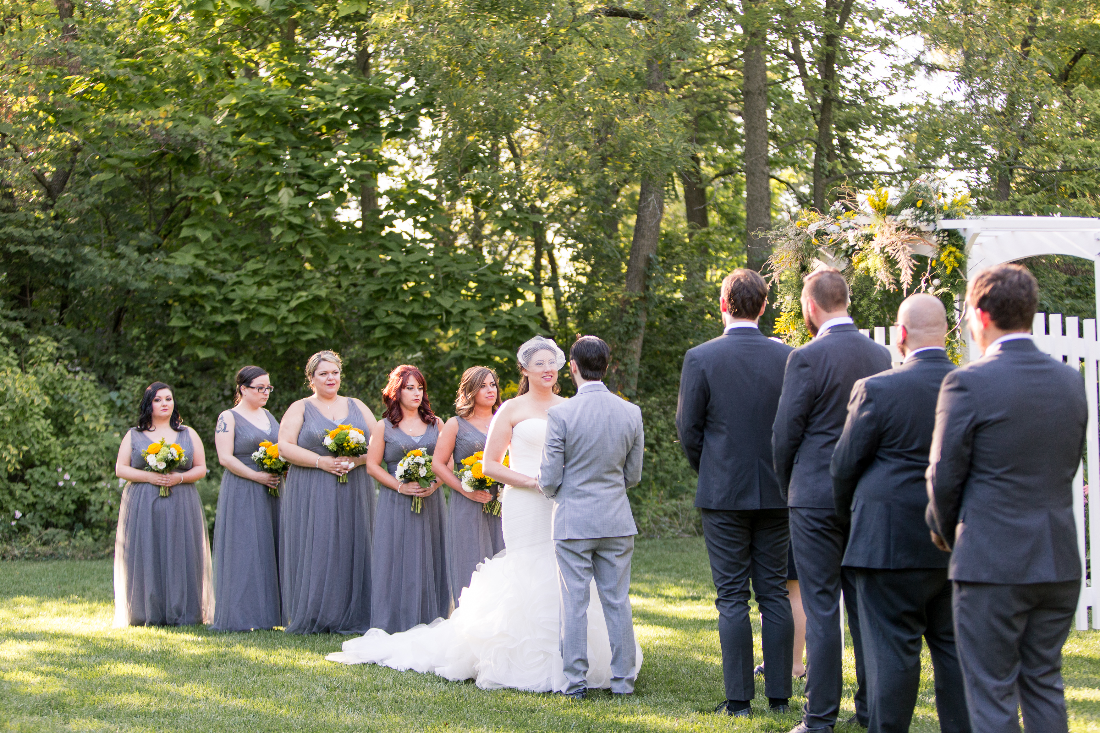 bride, groom and wedding party during Oakhurst Gardens wedding at Minnetrista in Muncie Indiana