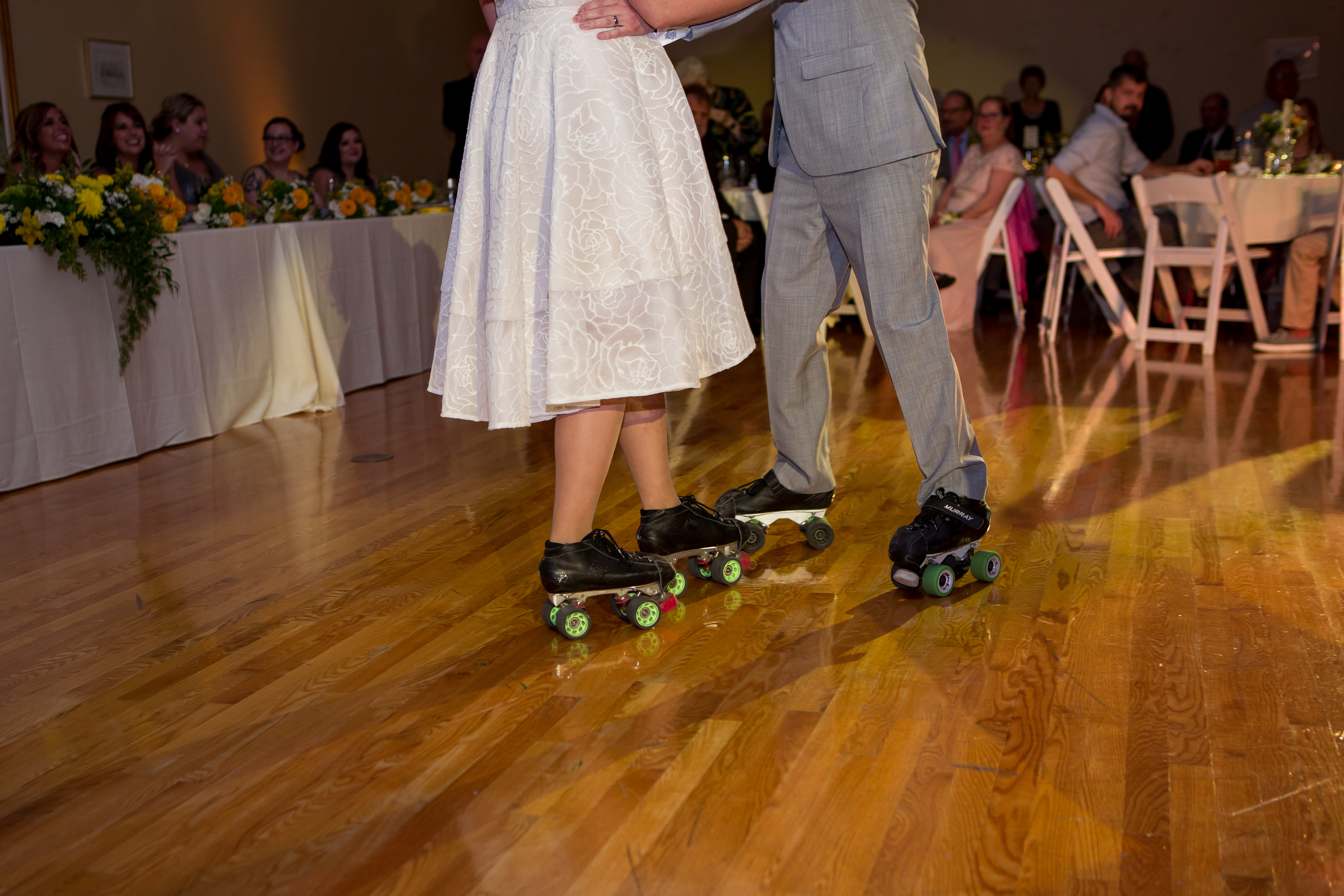 bride and groom first dance on rollerskates at Minnetrista in Muncie Indiana
