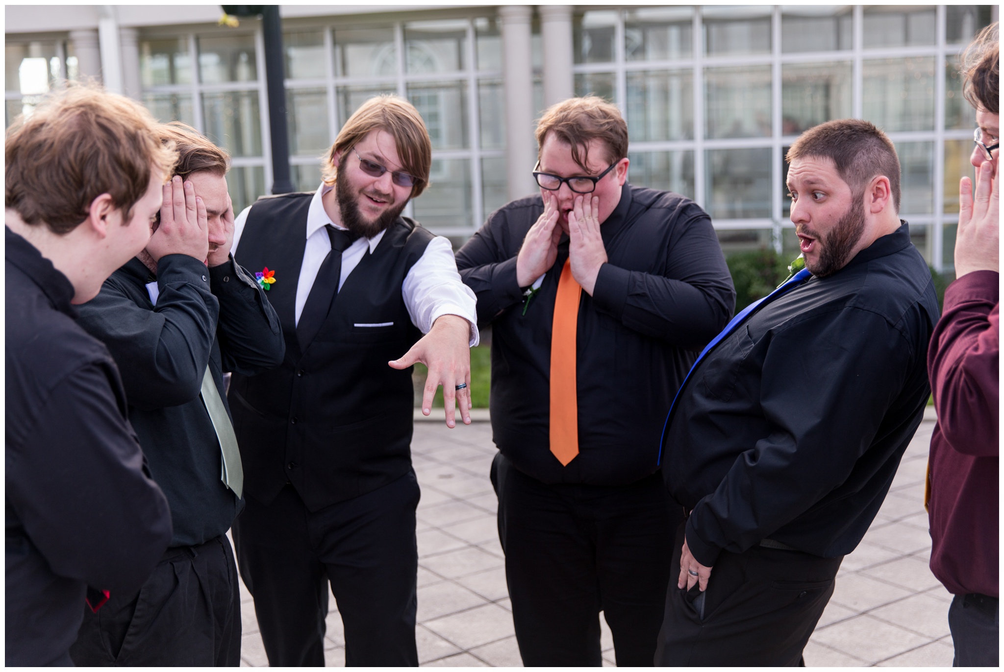 groomsmen reacting to groom's ring at Community Life Center wedding in Indianapolis Indiana