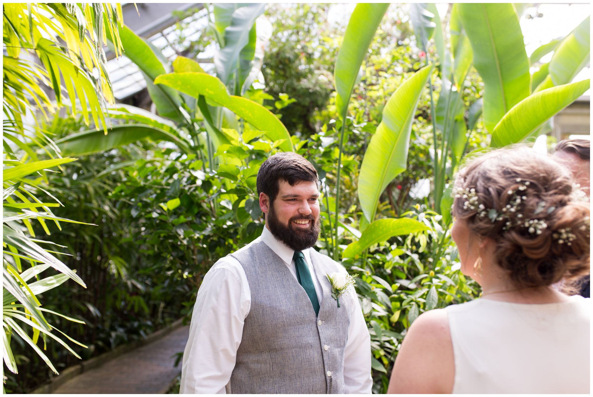 bride and groom first look at Garfield Park Conservatory Indianapolis wedding