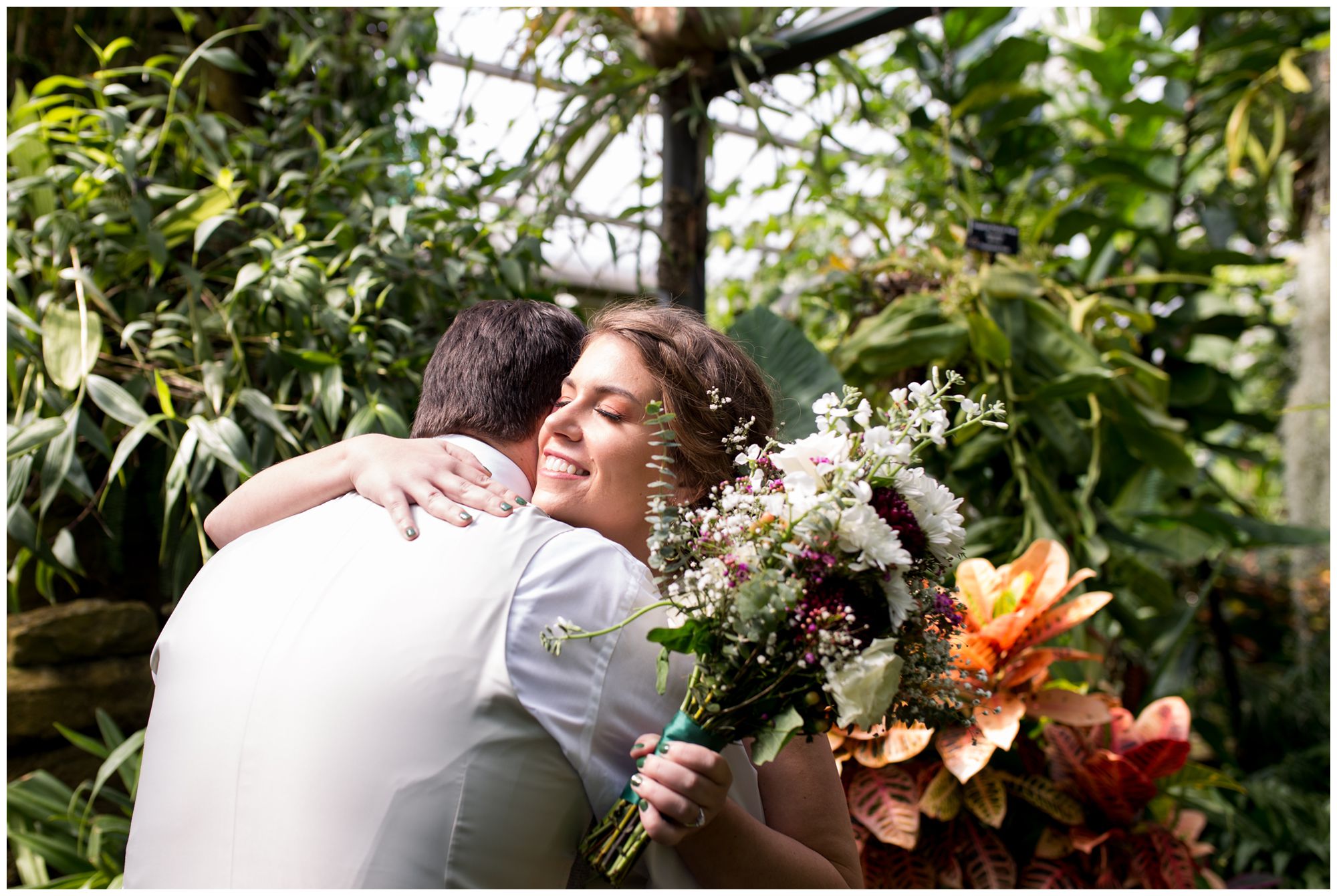 bride and groom first look at Garfield Park Conservatory Indianapolis elopement