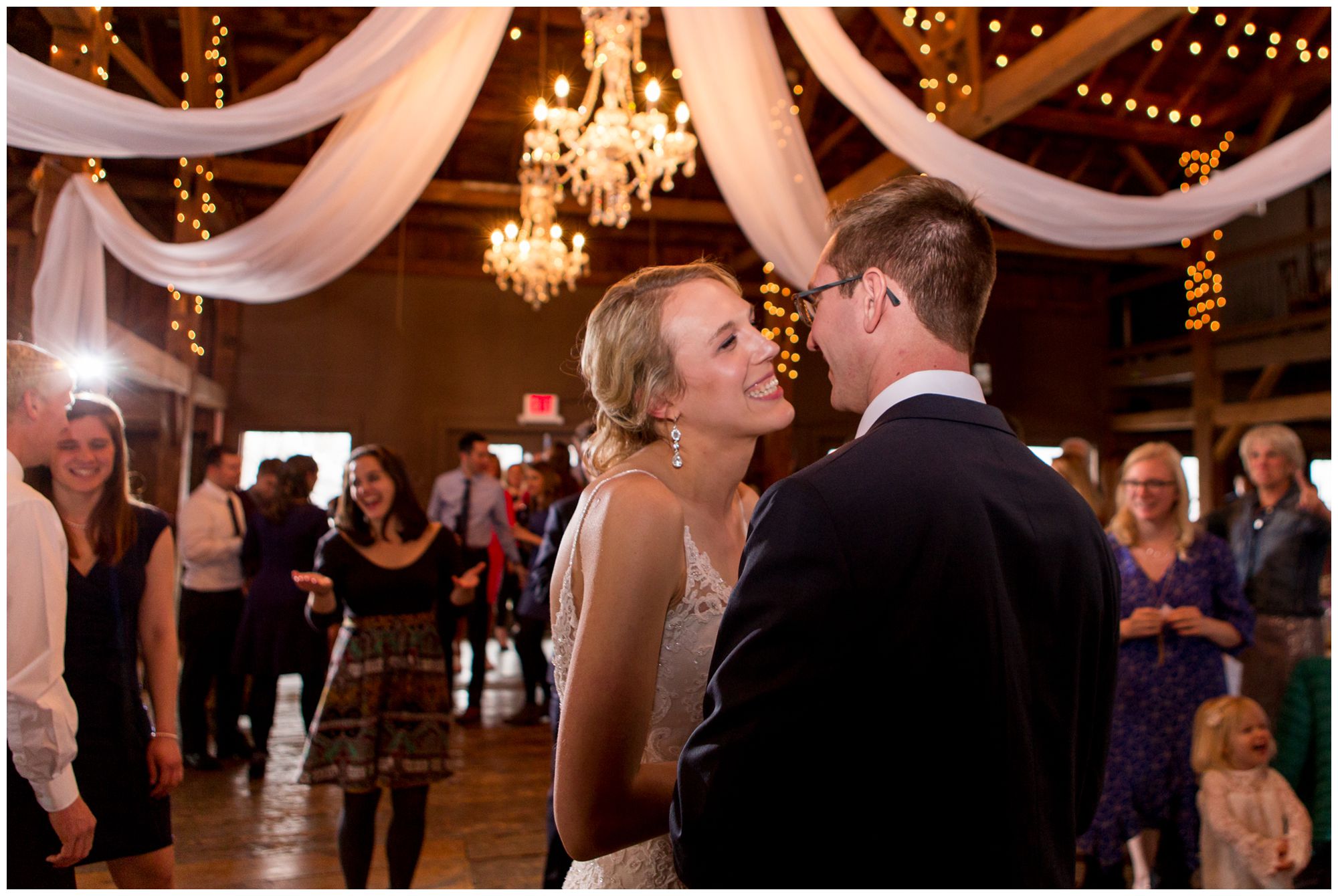 bride and groom dance during Mustard Seed Gardens wedding reception in Noblesville Indiana
