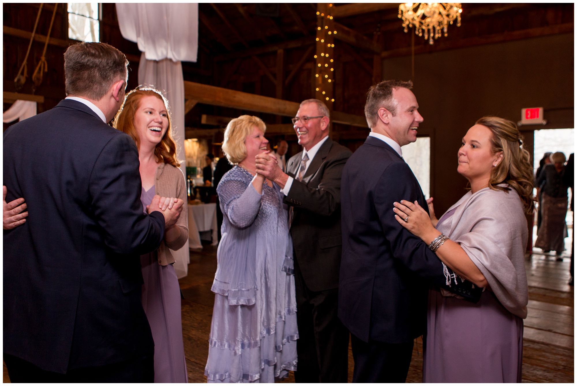 guests dance during wedding reception at Mustard Seed Gardens in Noblesville Indiana