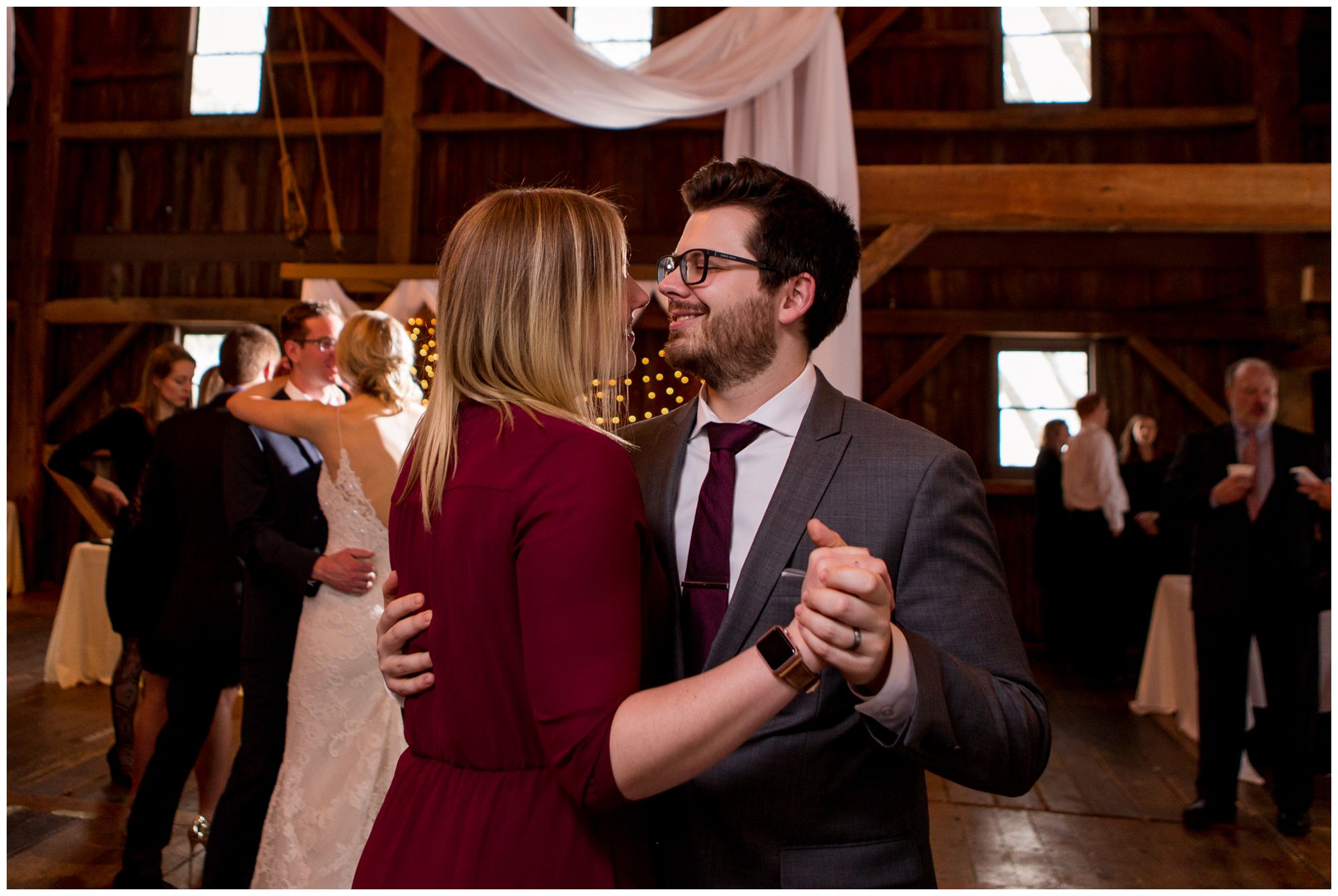 guests dance during wedding reception at Mustard Seed Gardens in Noblesville Indiana