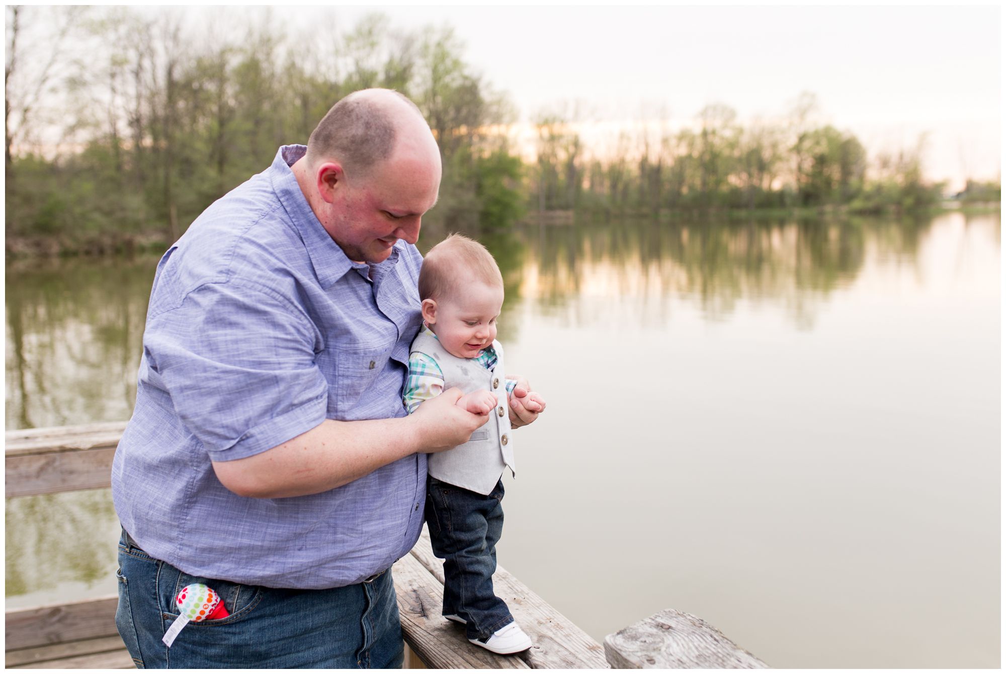 dad holds six month old son at Kokomo Reservoir during family session