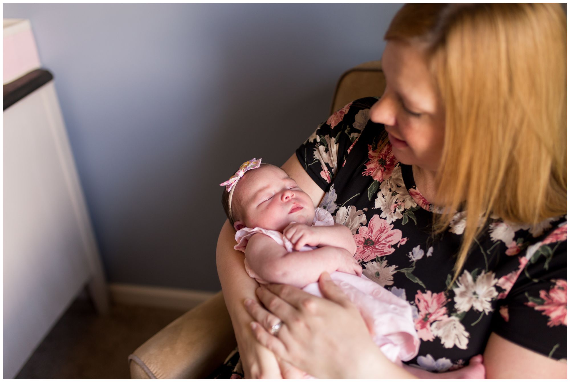 mom rocks newborn baby during Westfield newborn session