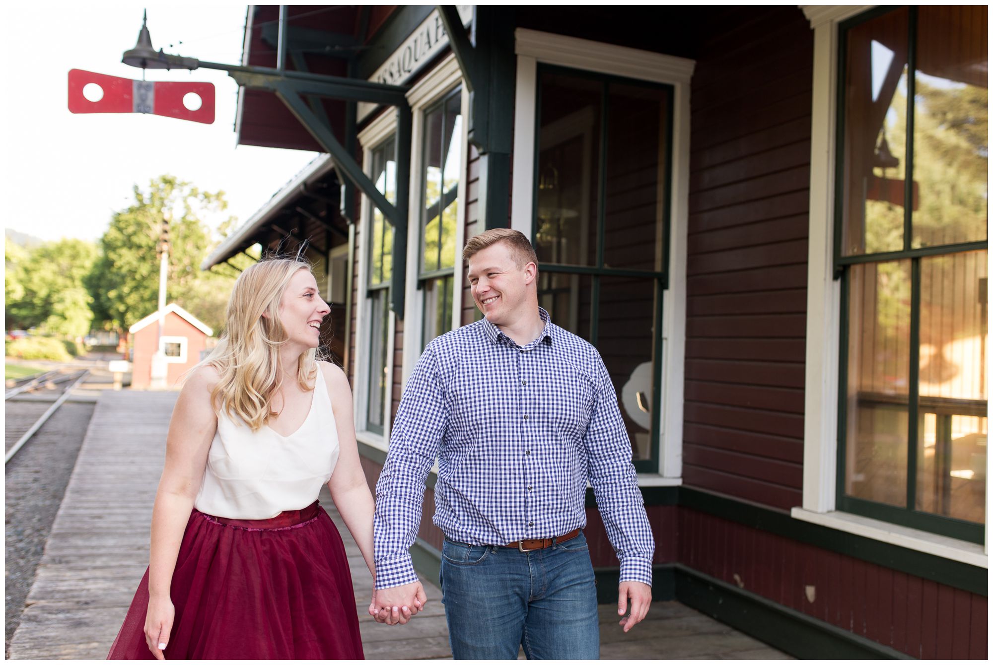 couple holds hands at Issaquah Depot Museum engagement session // Autumn Howell Photography