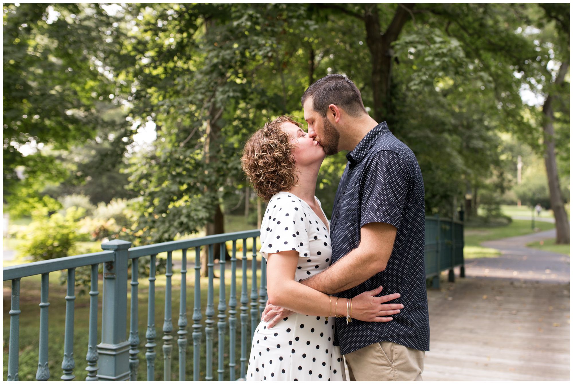 bride and groom kiss during Charley Creek Gardens engagement session