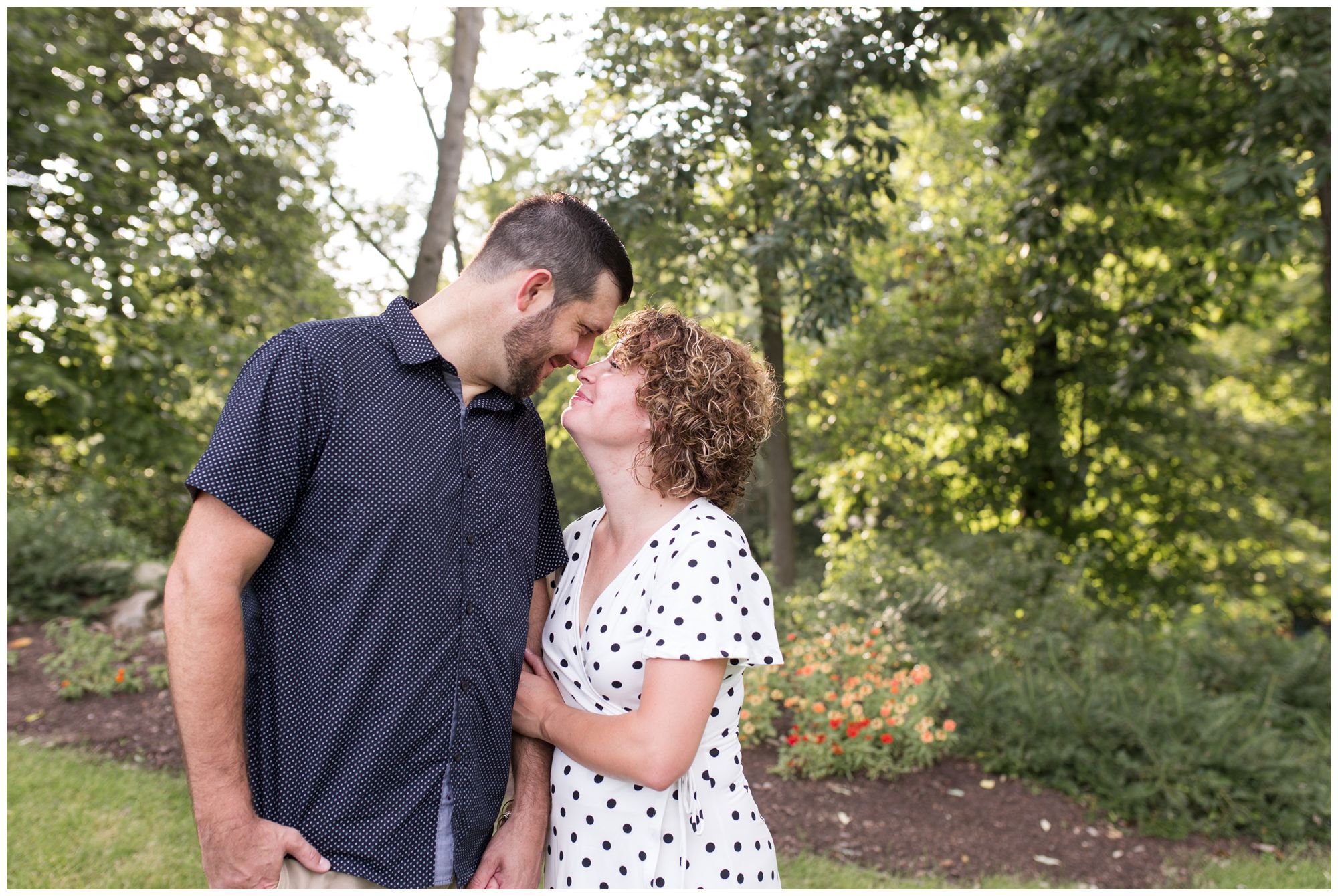 bride and groom touch noses during Wabash Indiana engagement session at Charley Creek Gardens