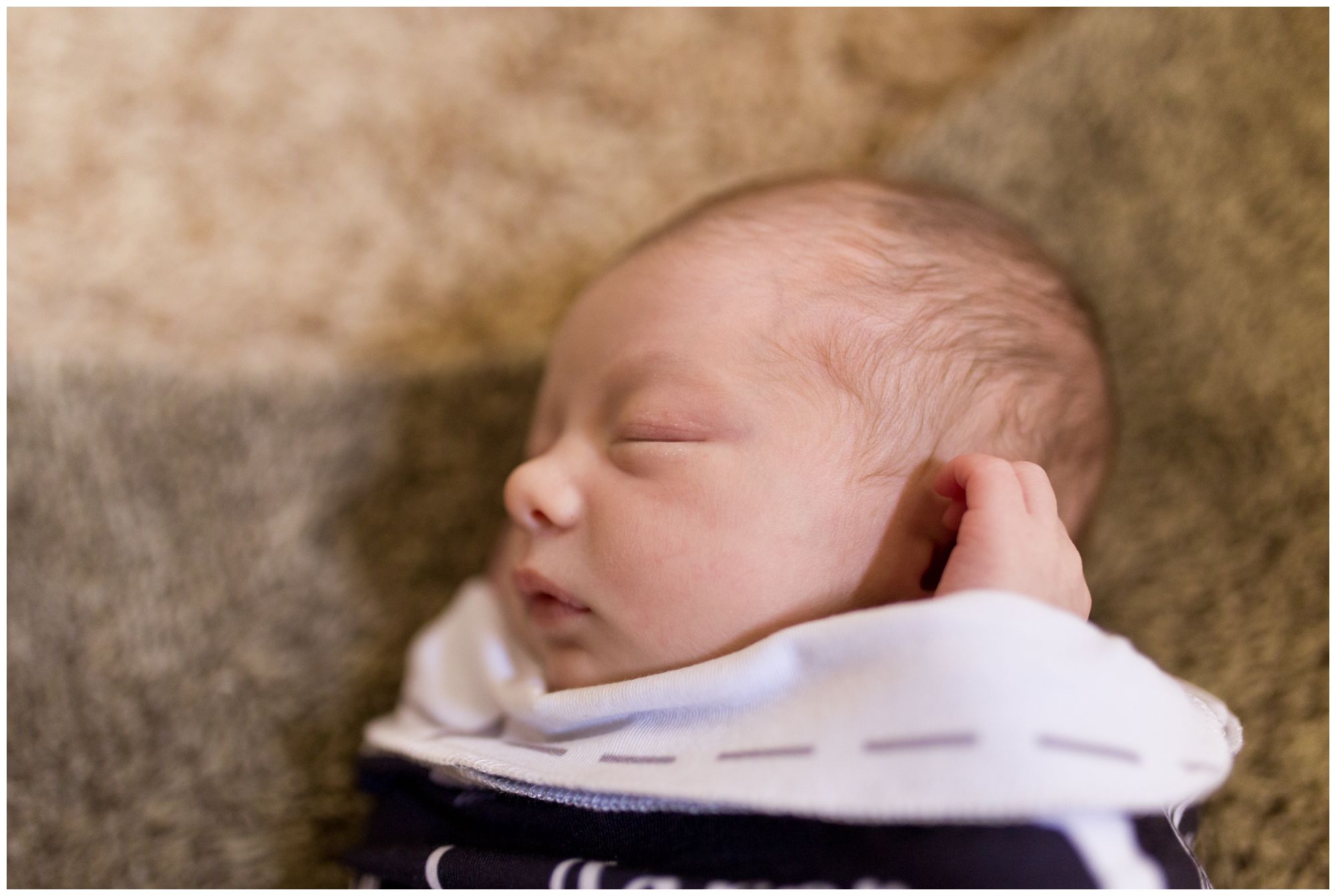 Kokomo newborn photographer captures baby sleeping in custom swaddle
