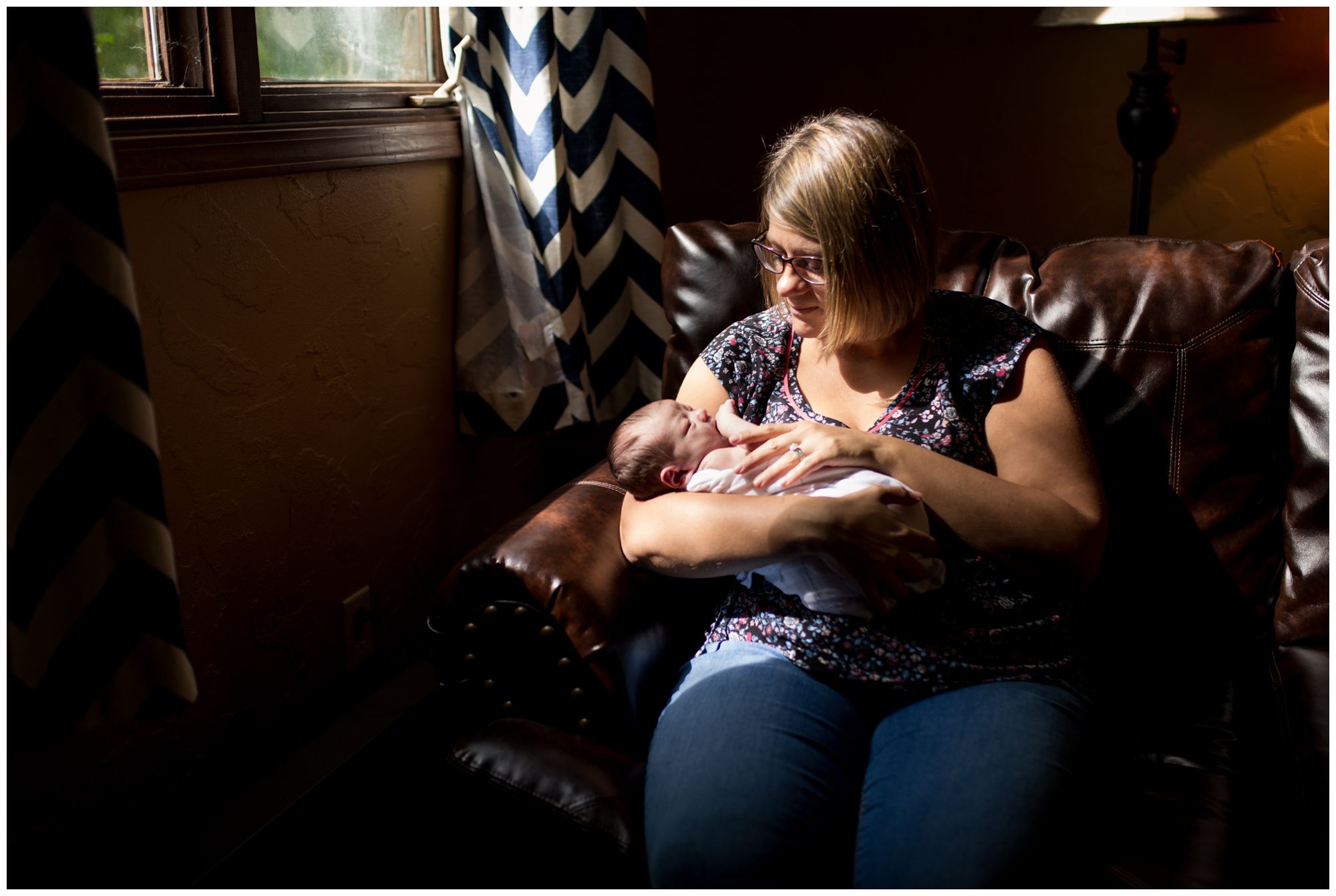 mom holds newborn during Kokomo newborn session
