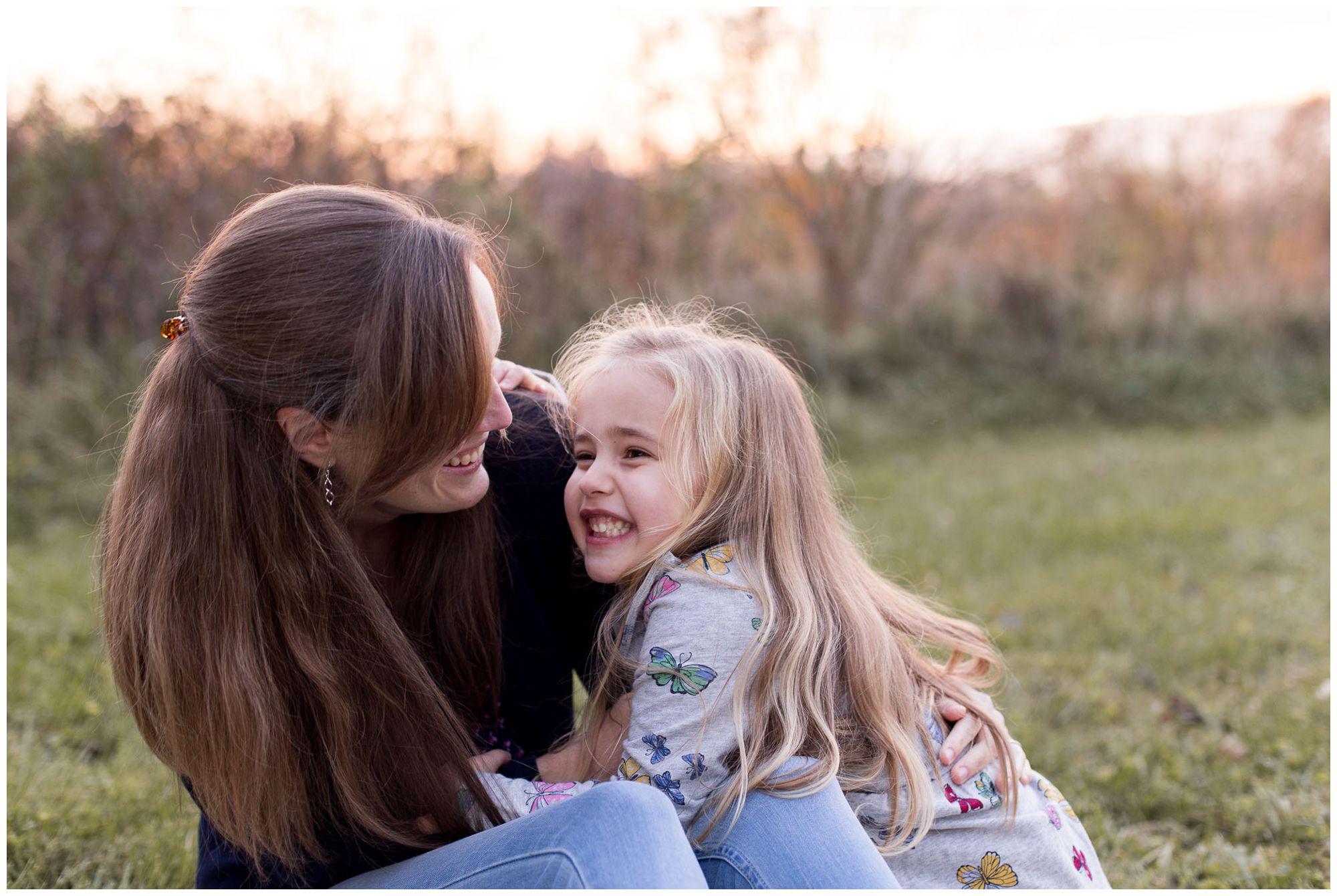 mom looks at daughter and hugs during Kokomo Indiana family session
