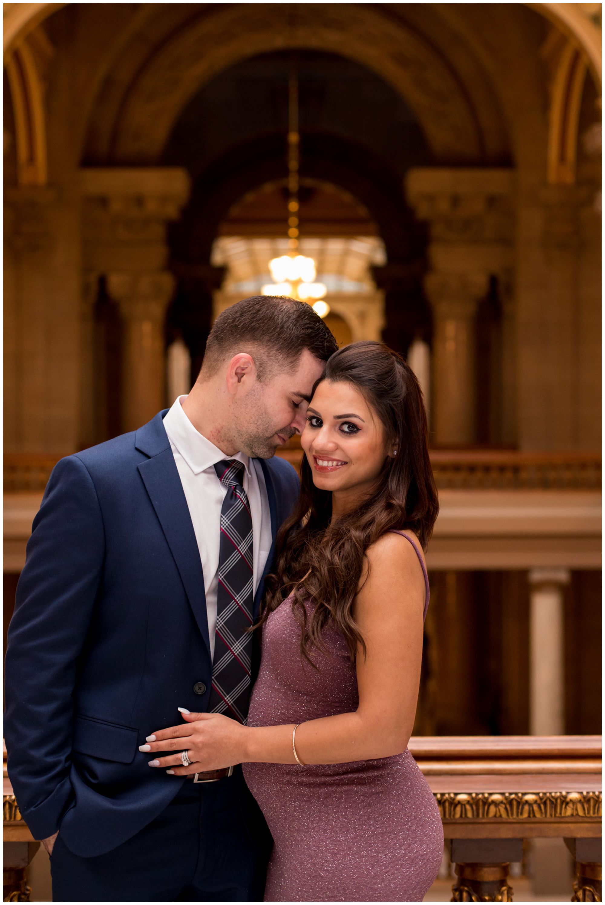 bride looks at camera during couples portraits after elopement ceremony at Indiana Statehouse