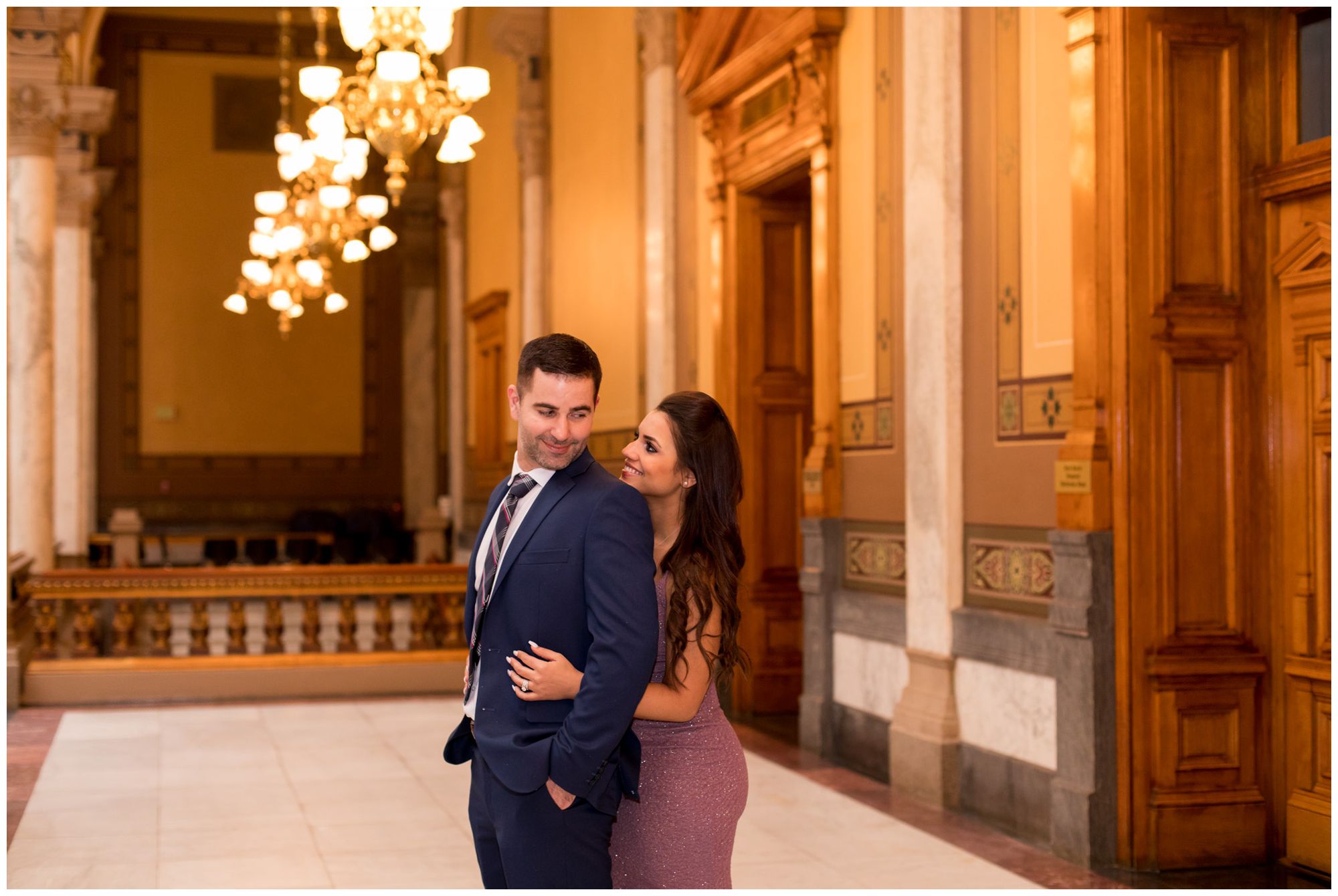 bride looks at groom during couples portraits after Indiana Statehouse elopement ceremony