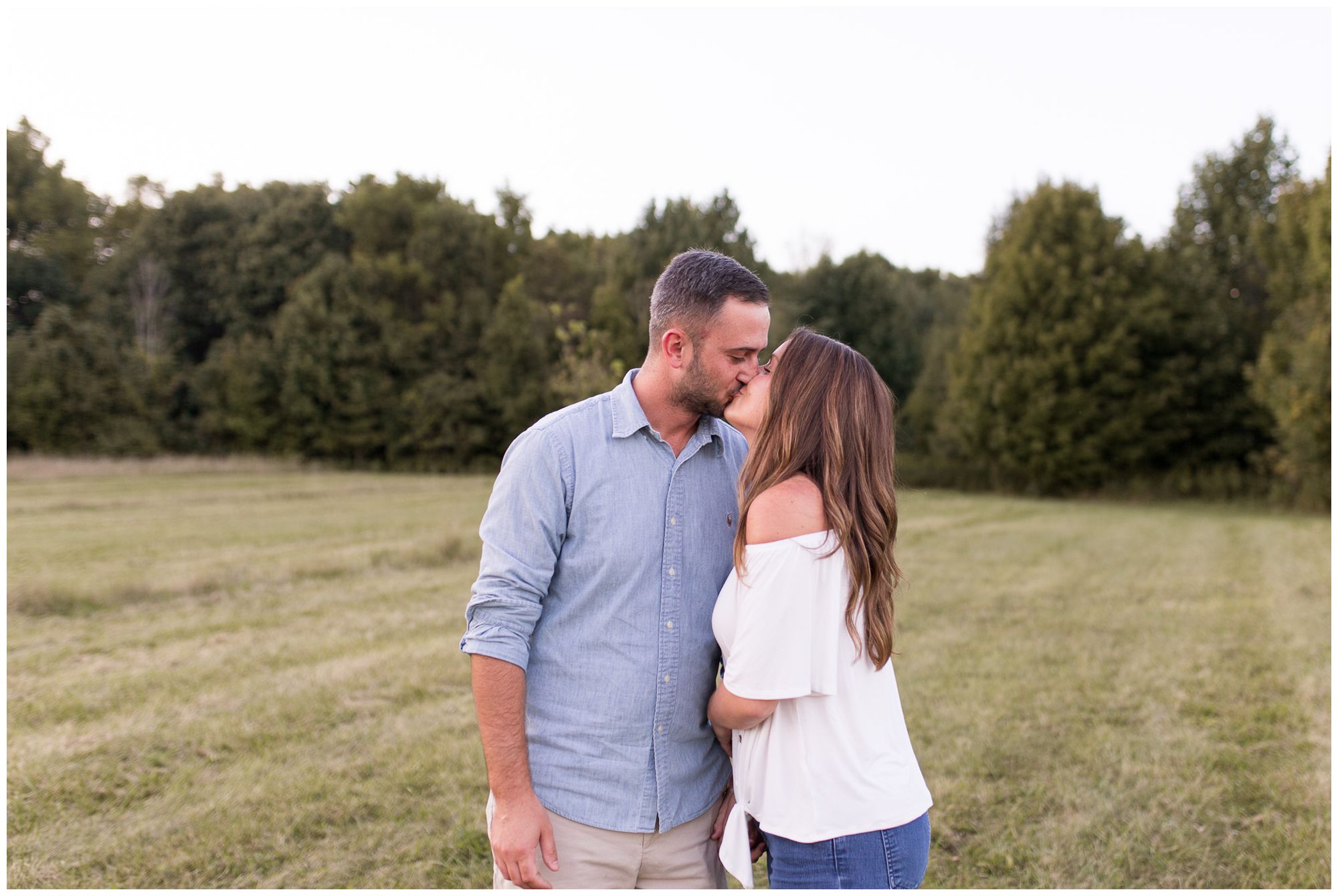 couple kissing during engagement session at Metea County Park in Fort Wayne Indiana