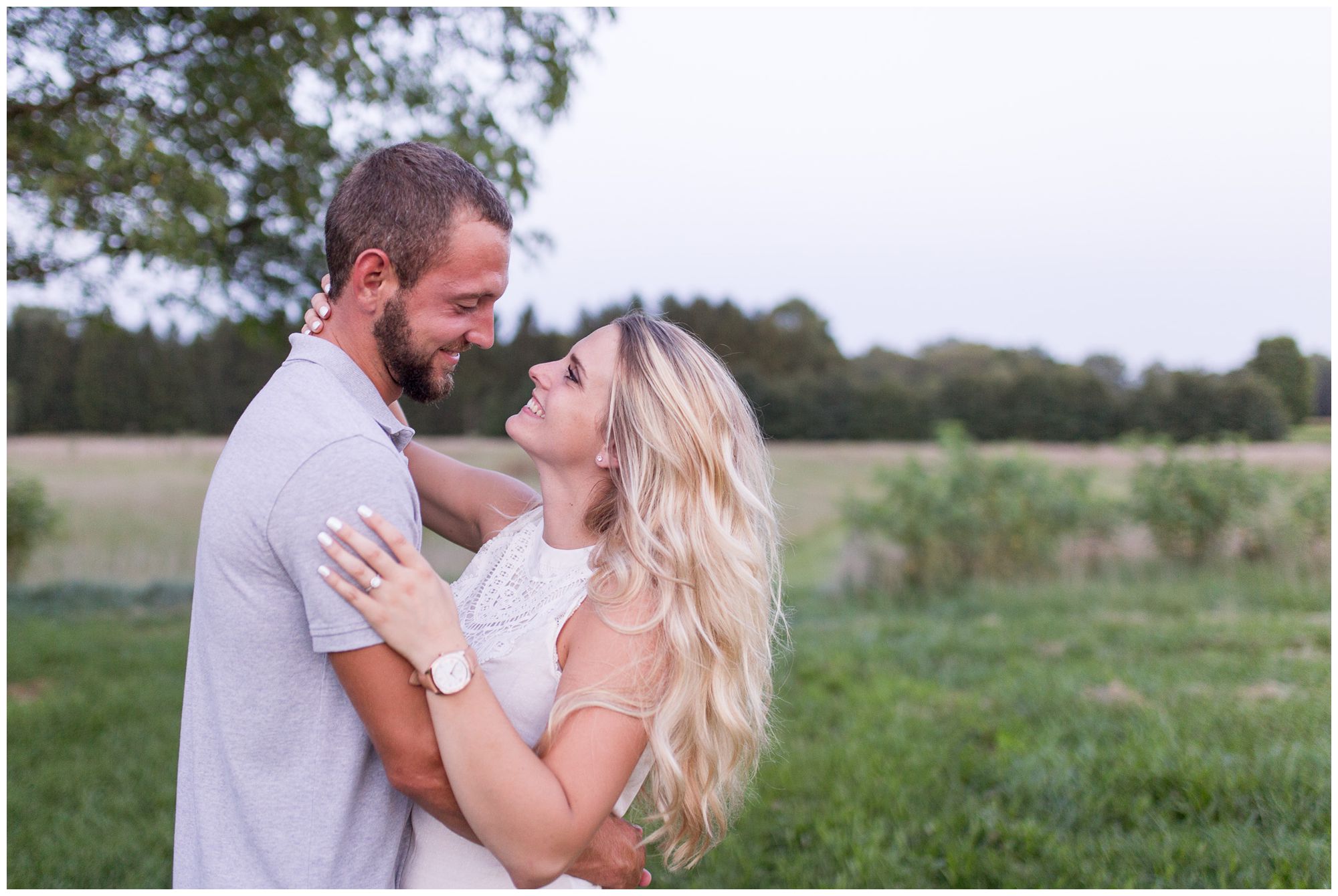 bride and groom sway during engagement session in Fort Wayne at Metea County Park