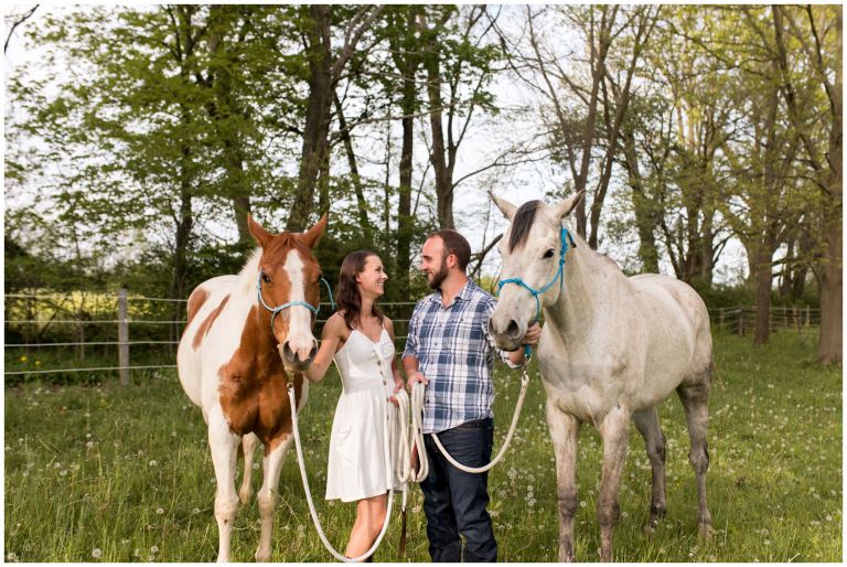 bride and groom with horses during engagement session in Indianapolis