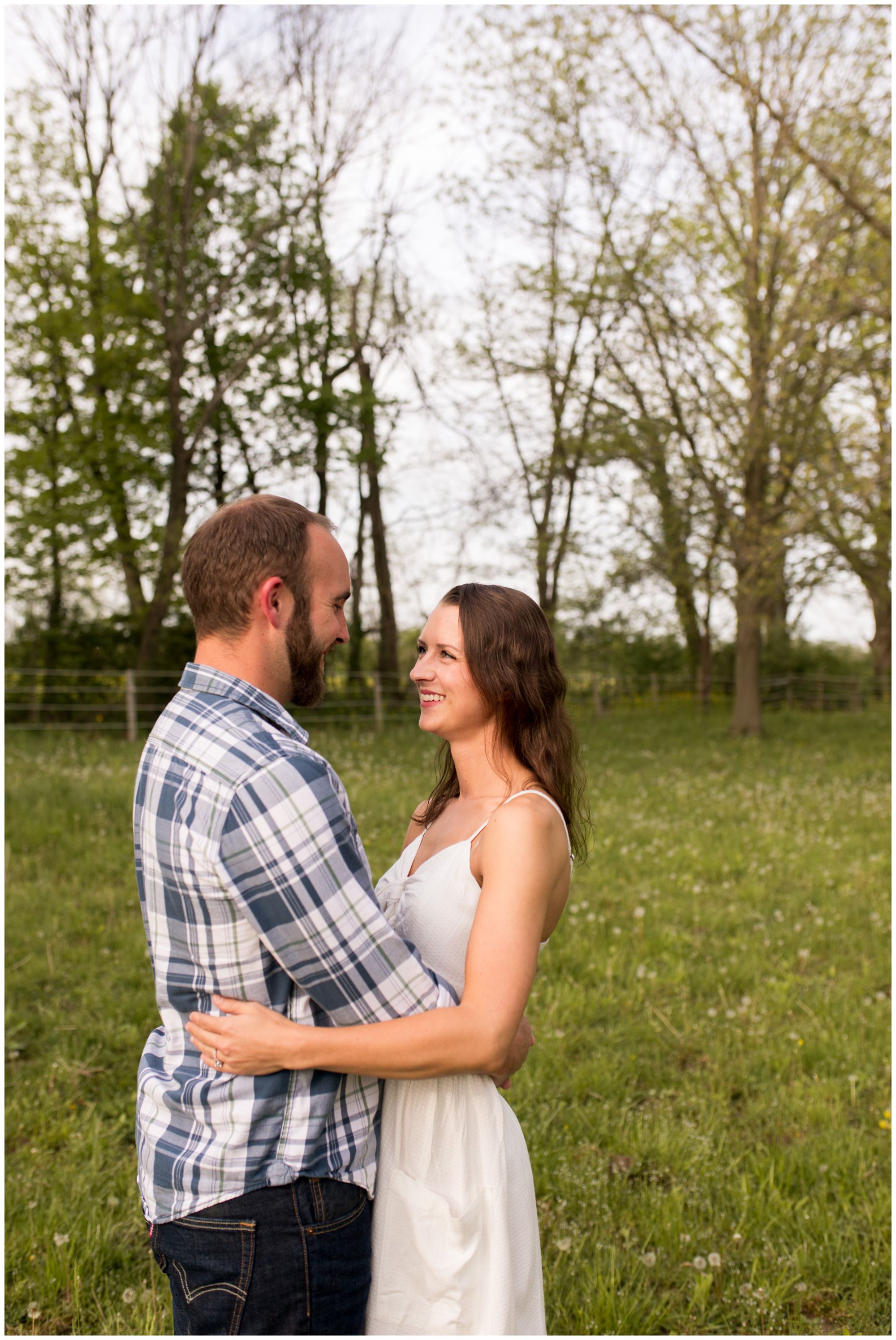 bride and groom hold one another during engagement session in Indianapolis