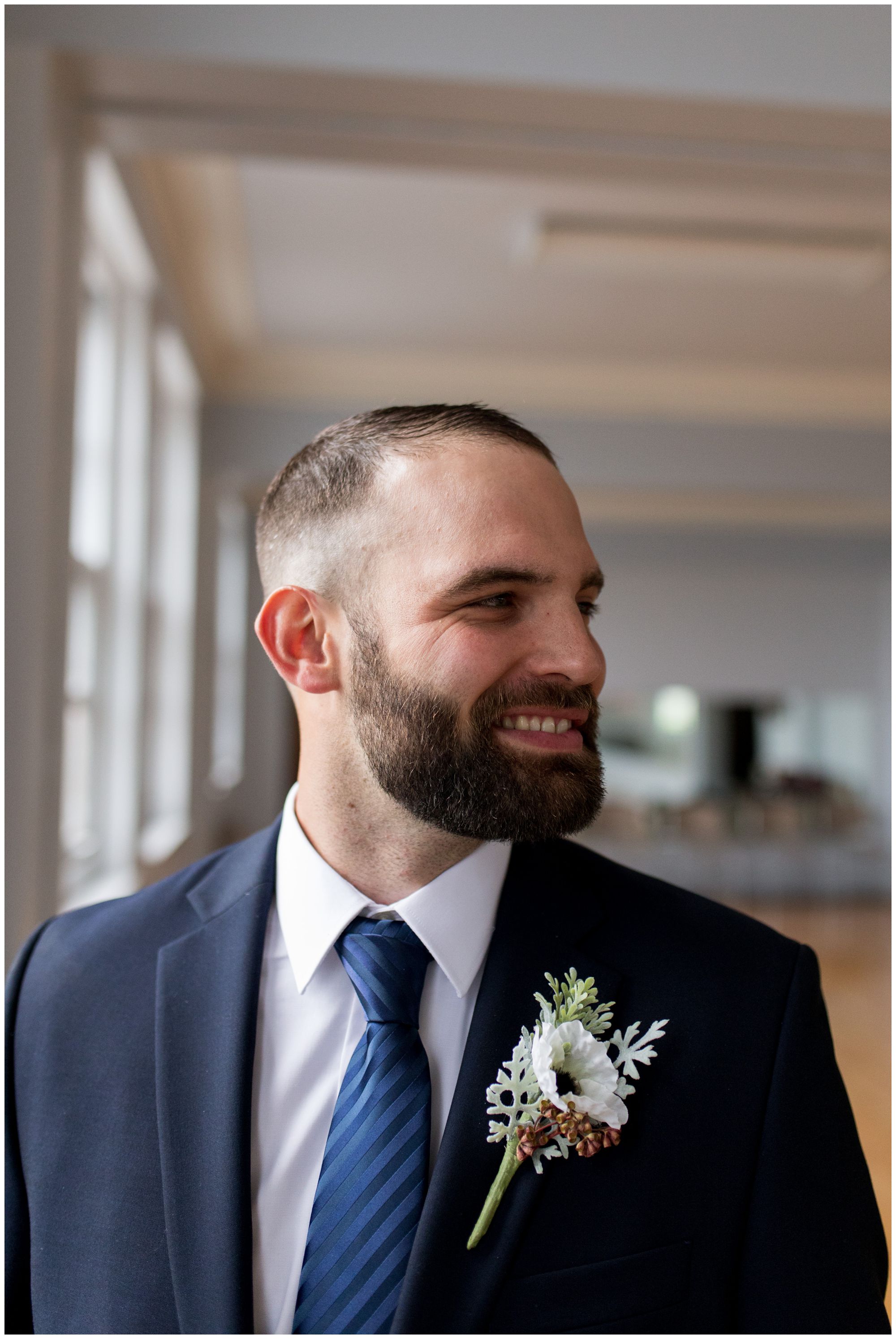 groom portraits at Cornerstone Center for the Arts wedding in Muncie Indiana