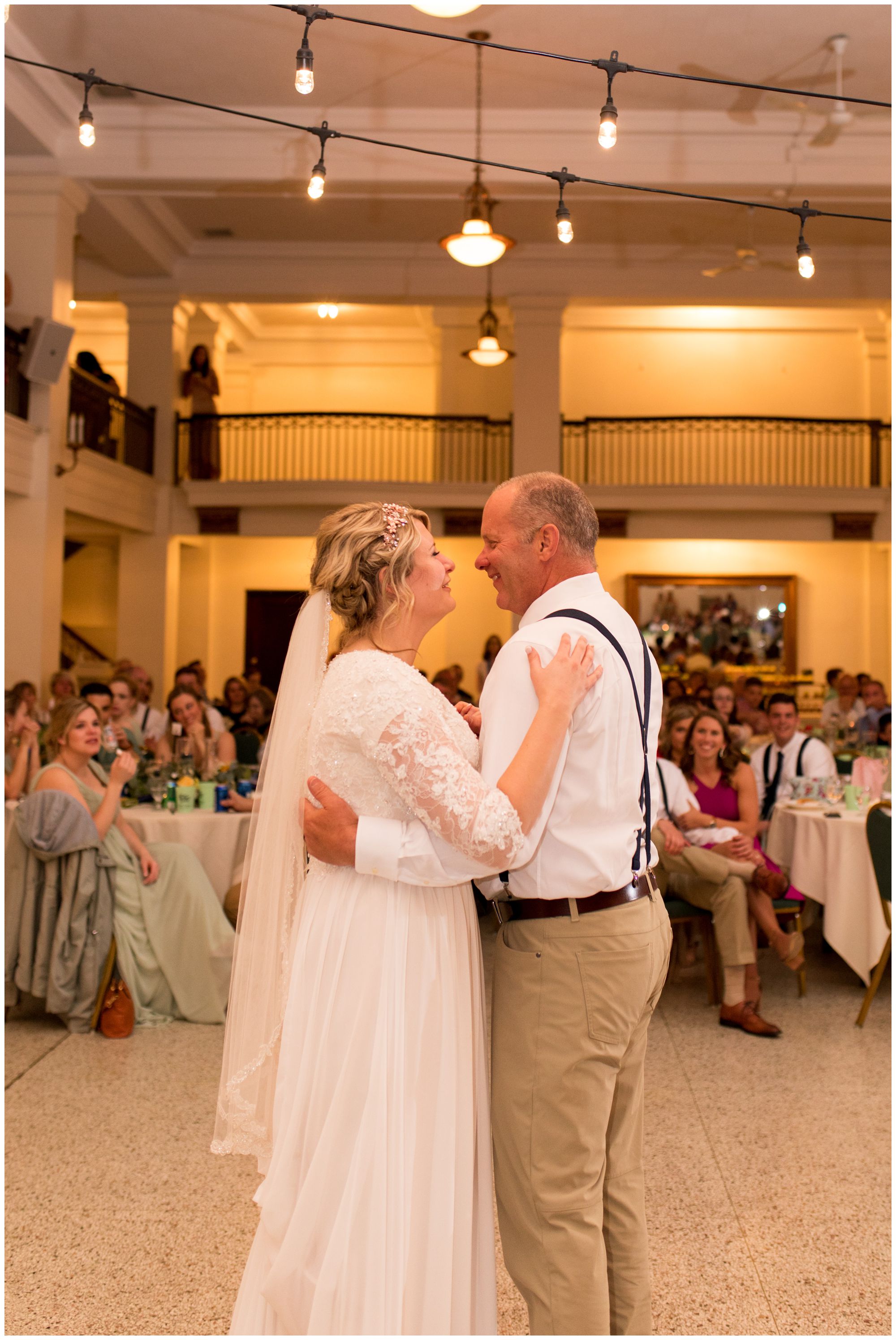 bride and father dance together during wedding reception at Cornerstone Center for the Arts in Muncie Indiana