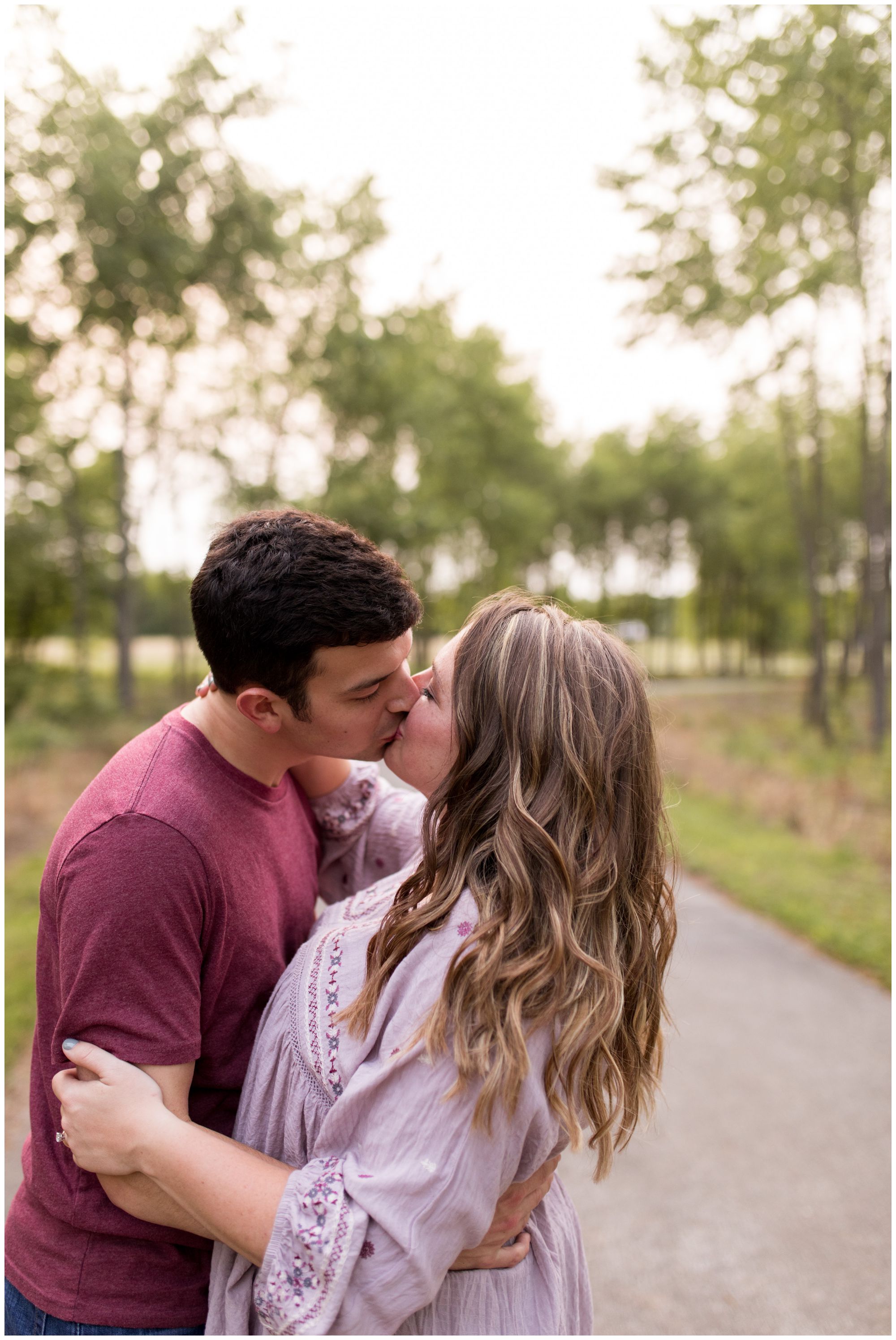 bride and groom kiss during engagement session at Prophetstown State Park