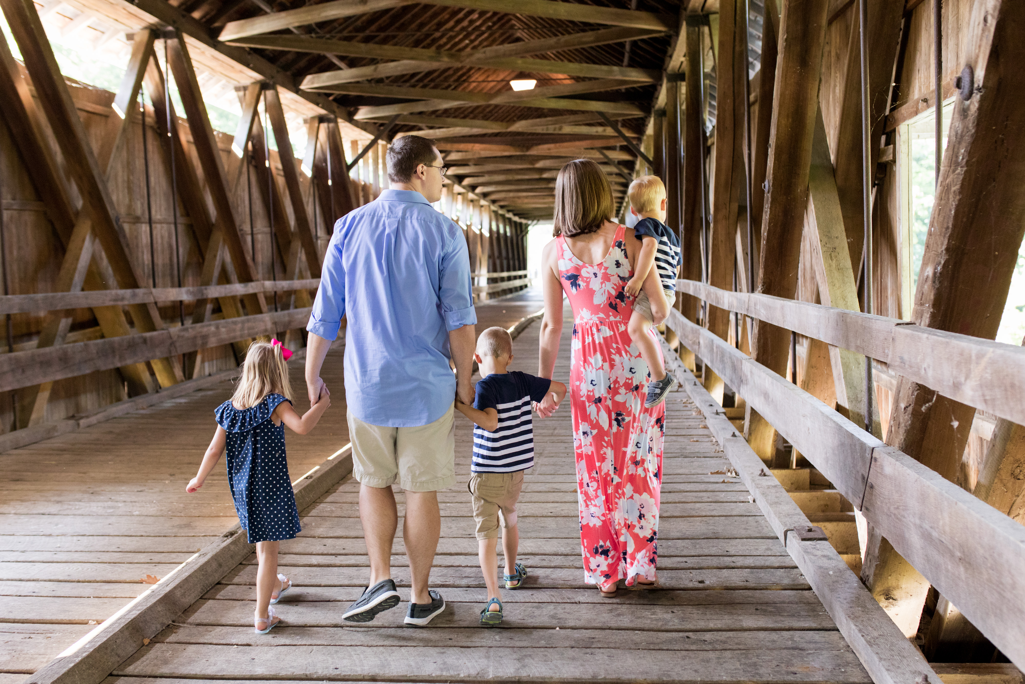 family walks together on Potters Bridge in Noblesville Indiana