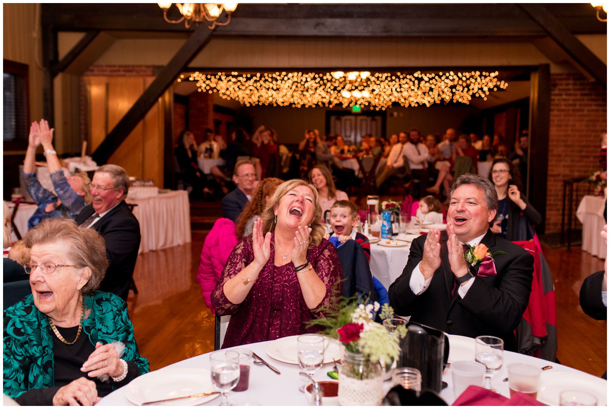 groom's parents laugh during Goeglein Homestead wedding reception
