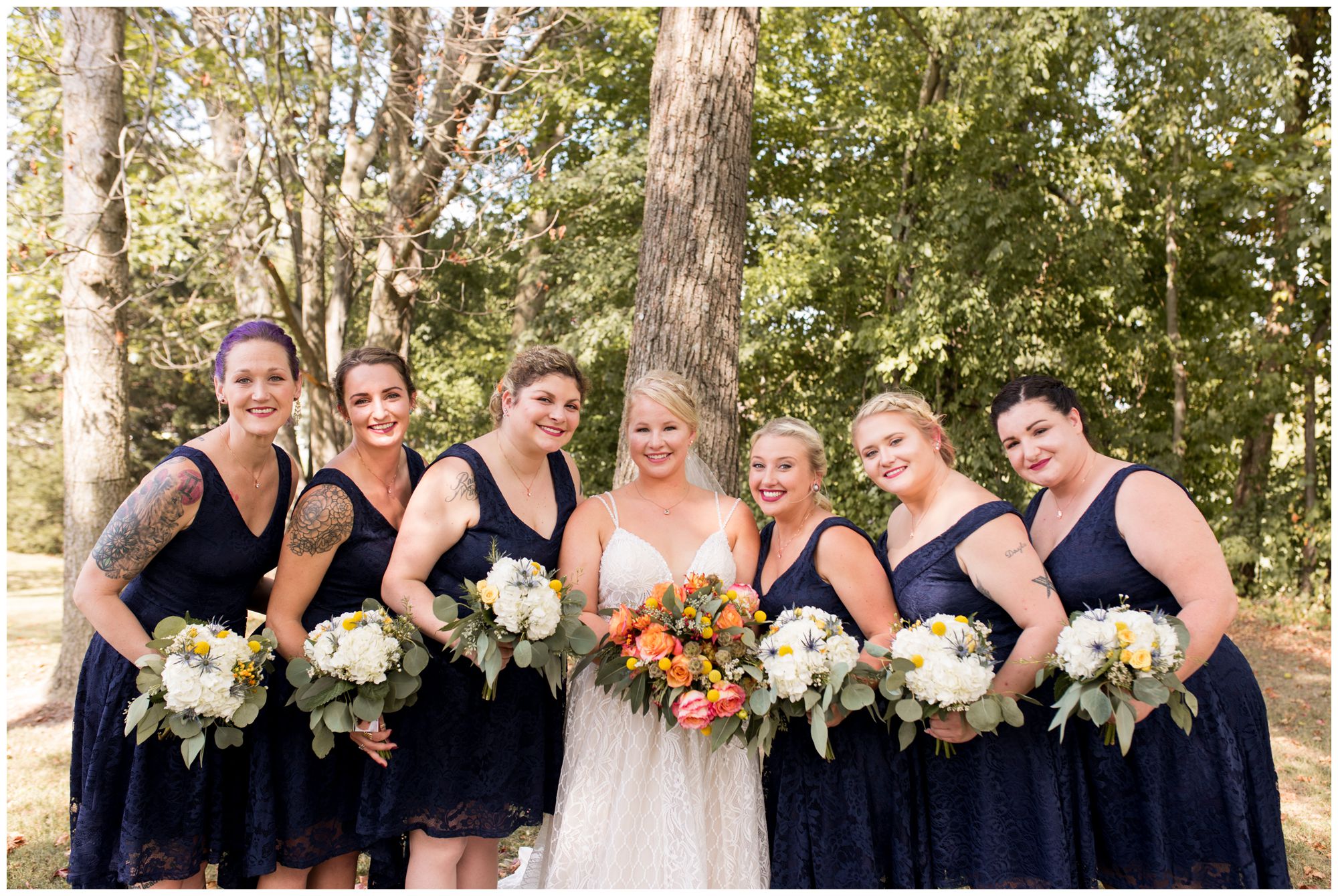 bride and bridesmaid portraits at Forest Park in Noblesville
