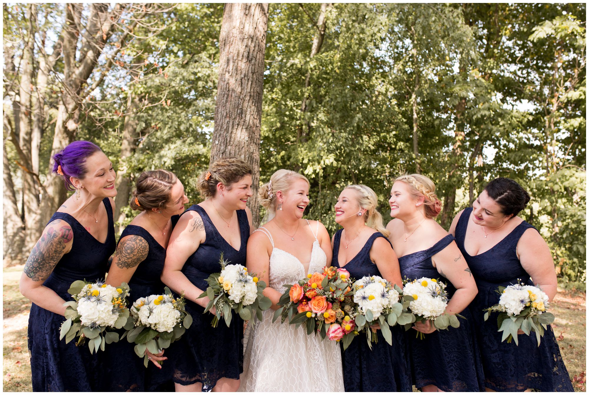 bride with bridesmaids at Forest Park in Noblesville Indiana