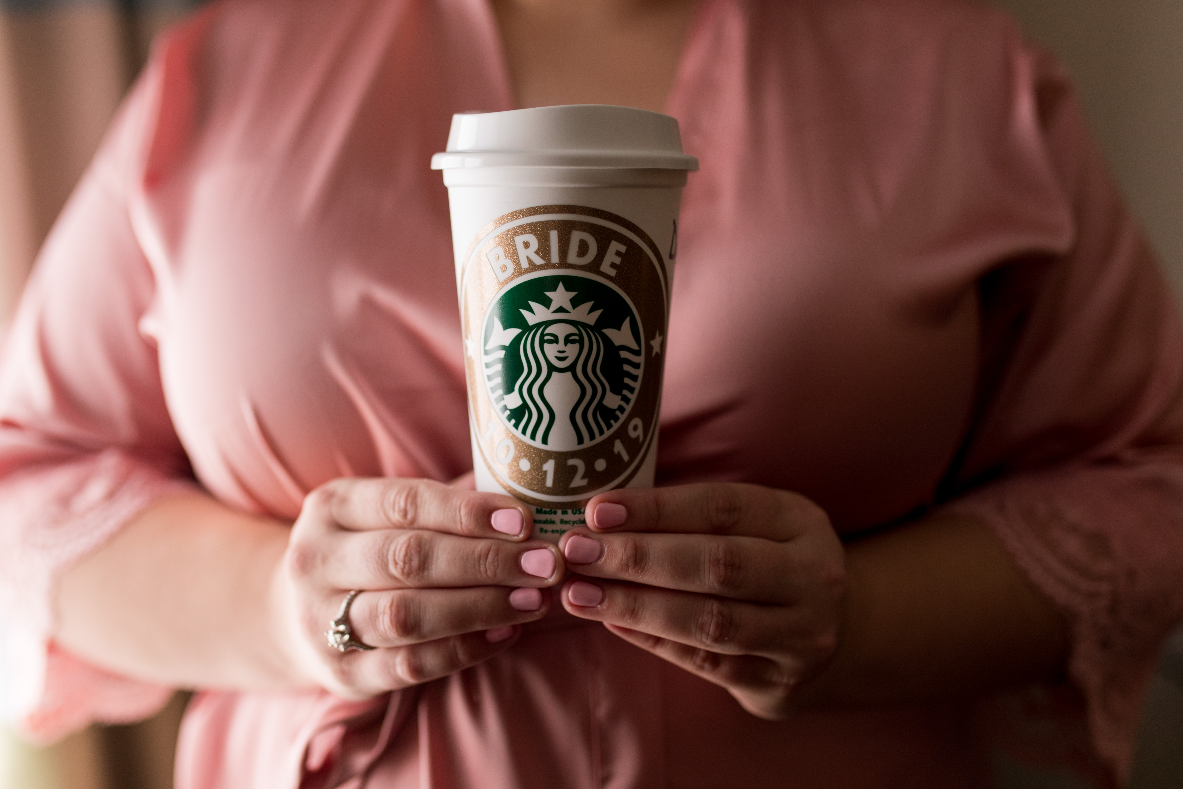 bride holding Starbucks cup before getting dressed in Kokomo Indiana