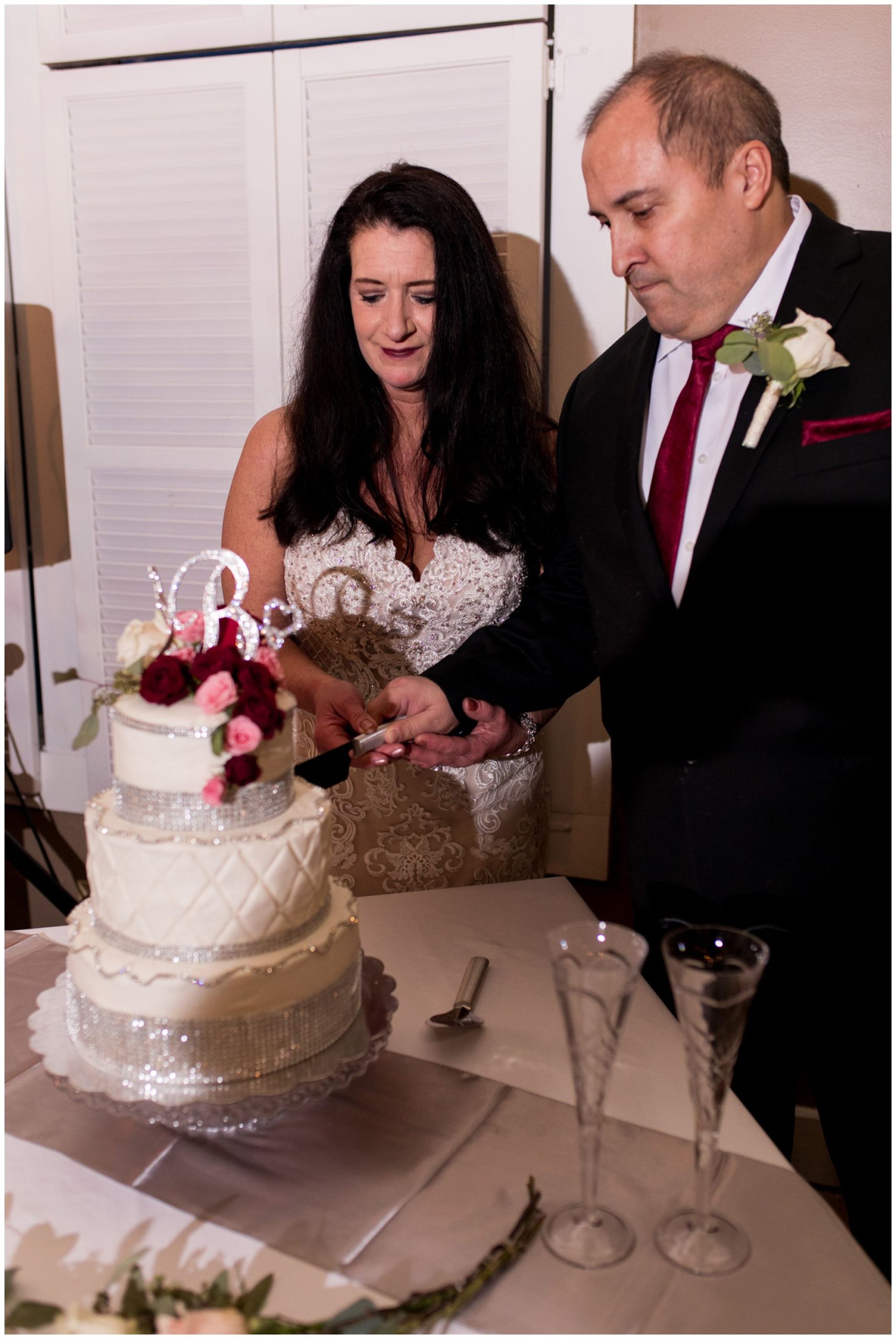 bride and groom cut wedding cake at Portland Golf Club in Portland Indiana
