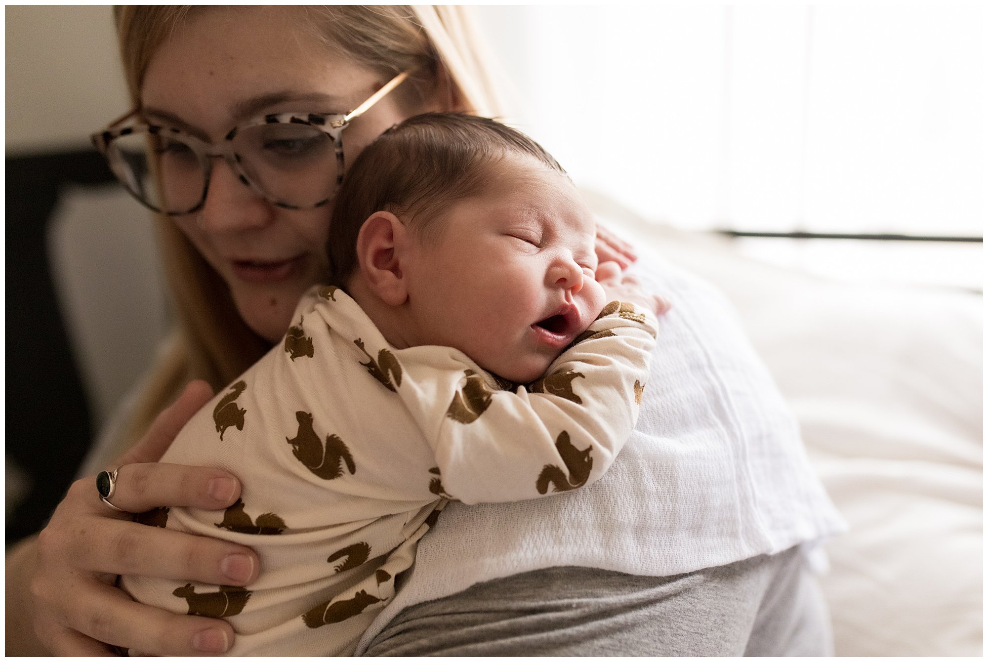 baby sleeps on mom's shoulder during Indianapolis newborn session