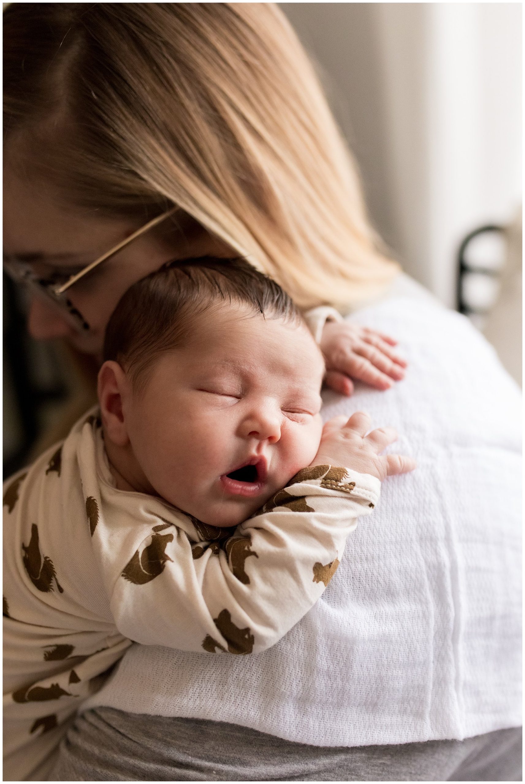 baby sleeps on mom's shoulder during Indianapolis newborn session