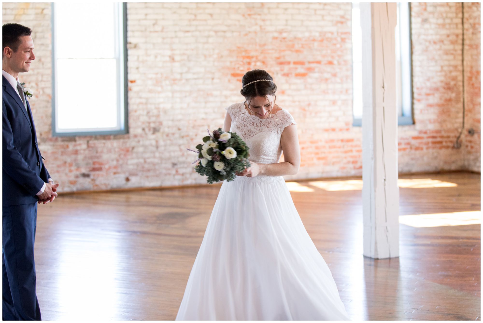 bride and groom first look in The Gallery at Bread & Chocolate in Goshen