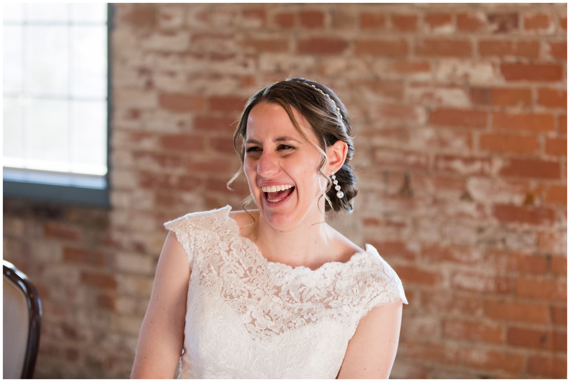 bride laughs during Goshen wedding reception