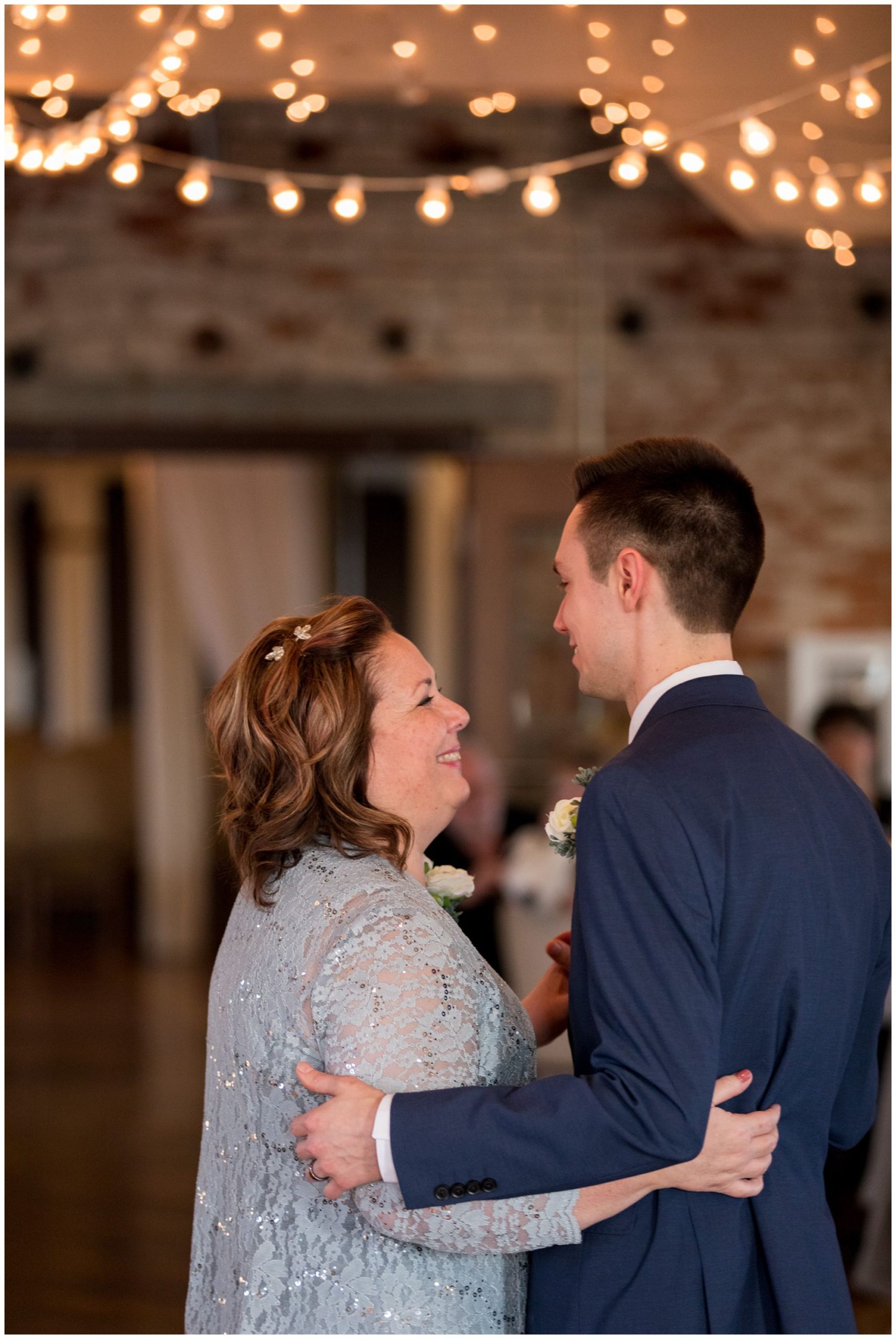 groom and mother dance together during Bread & Chocolate wedding reception