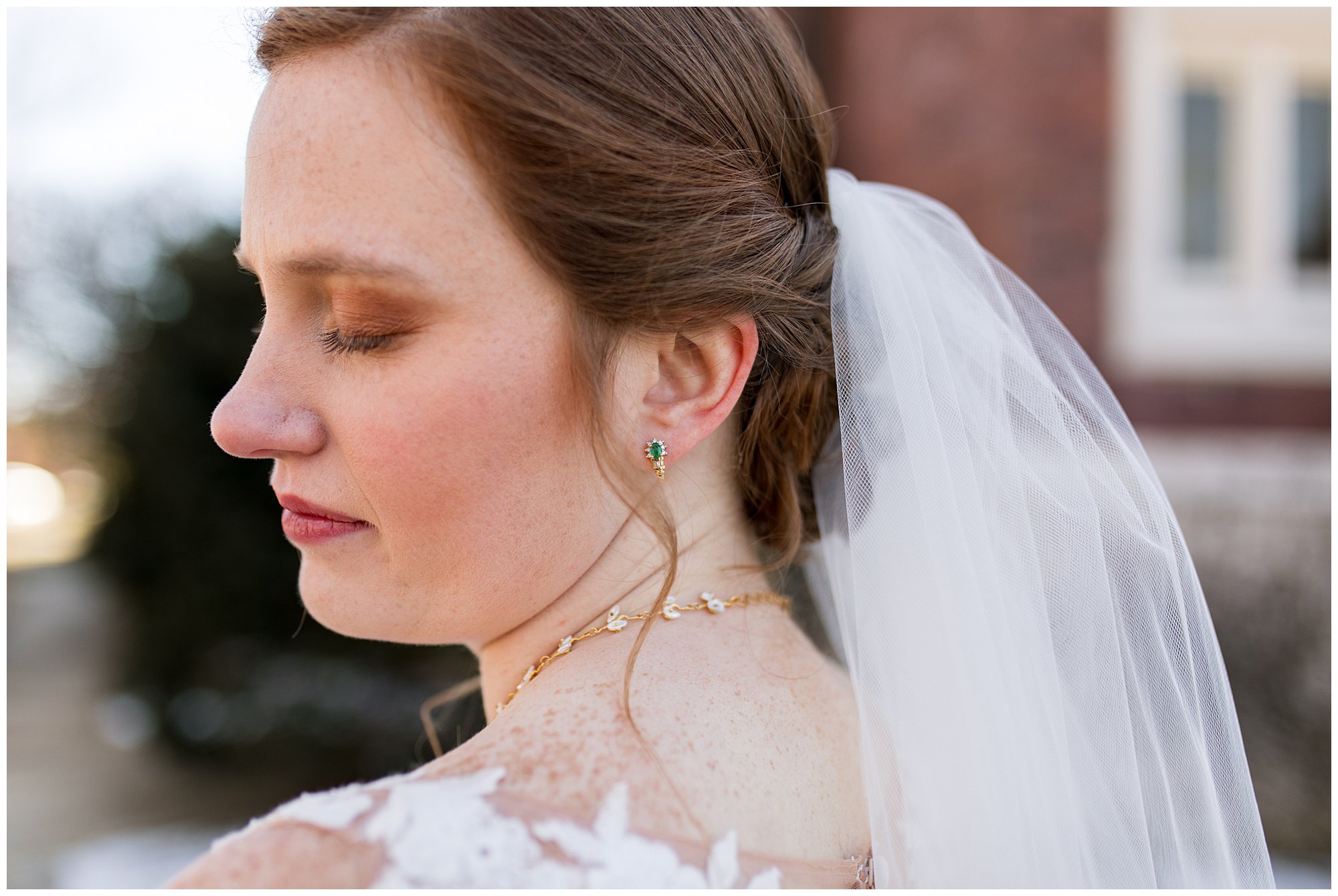 closeup of bride's emerald earrings