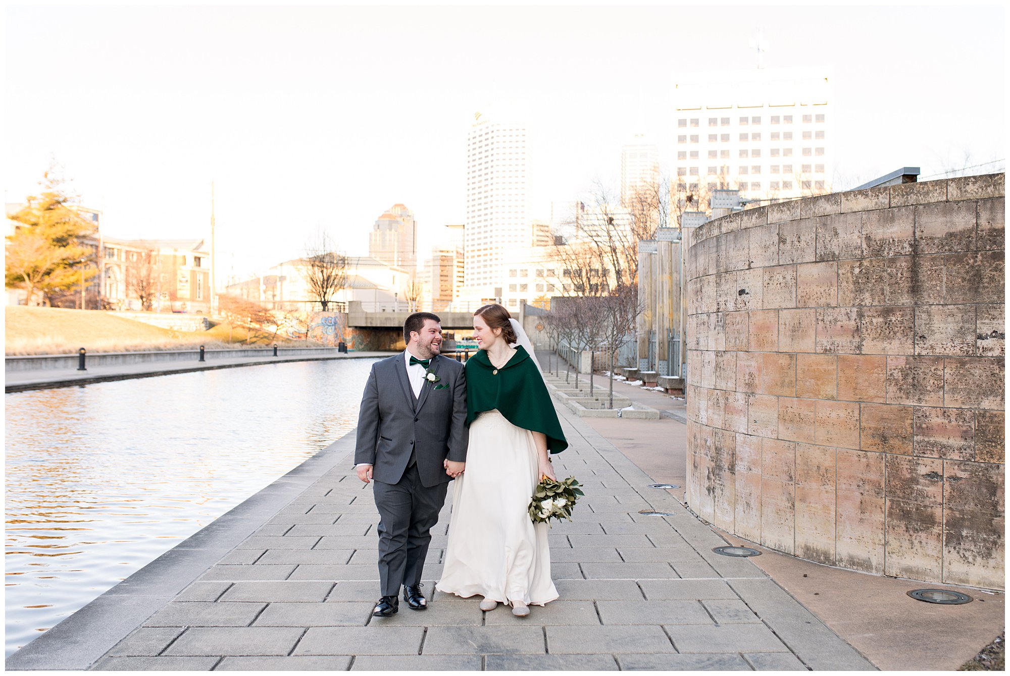 downtown Indianapolis bride and groom walking along White River Canal