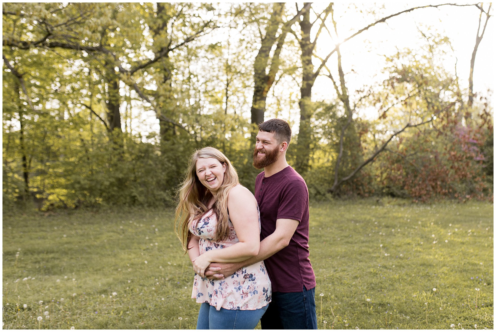 couple laughs together during Fort Wayne engagement session