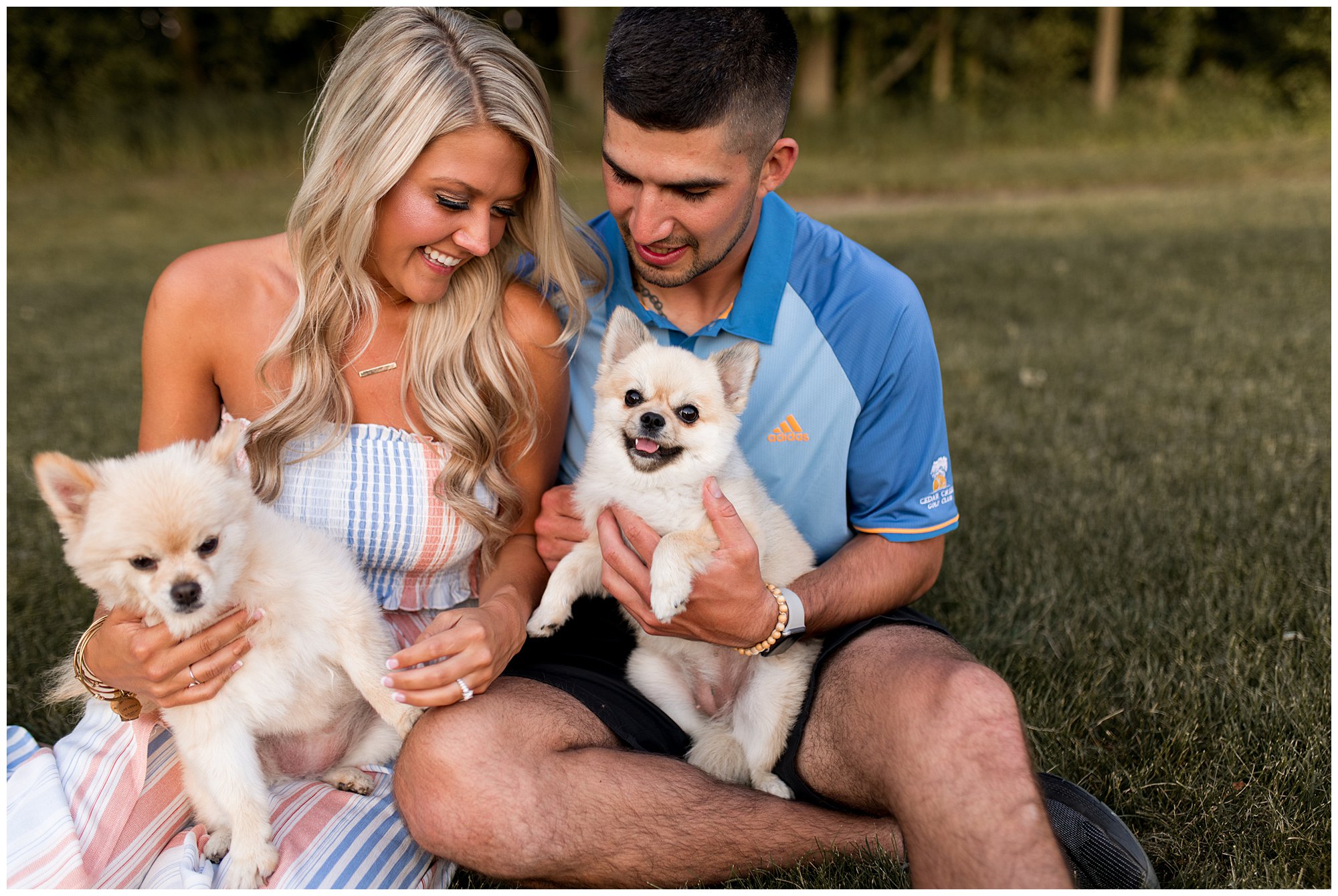 bride and groom holding their dogs during Fort Wayne engagement session