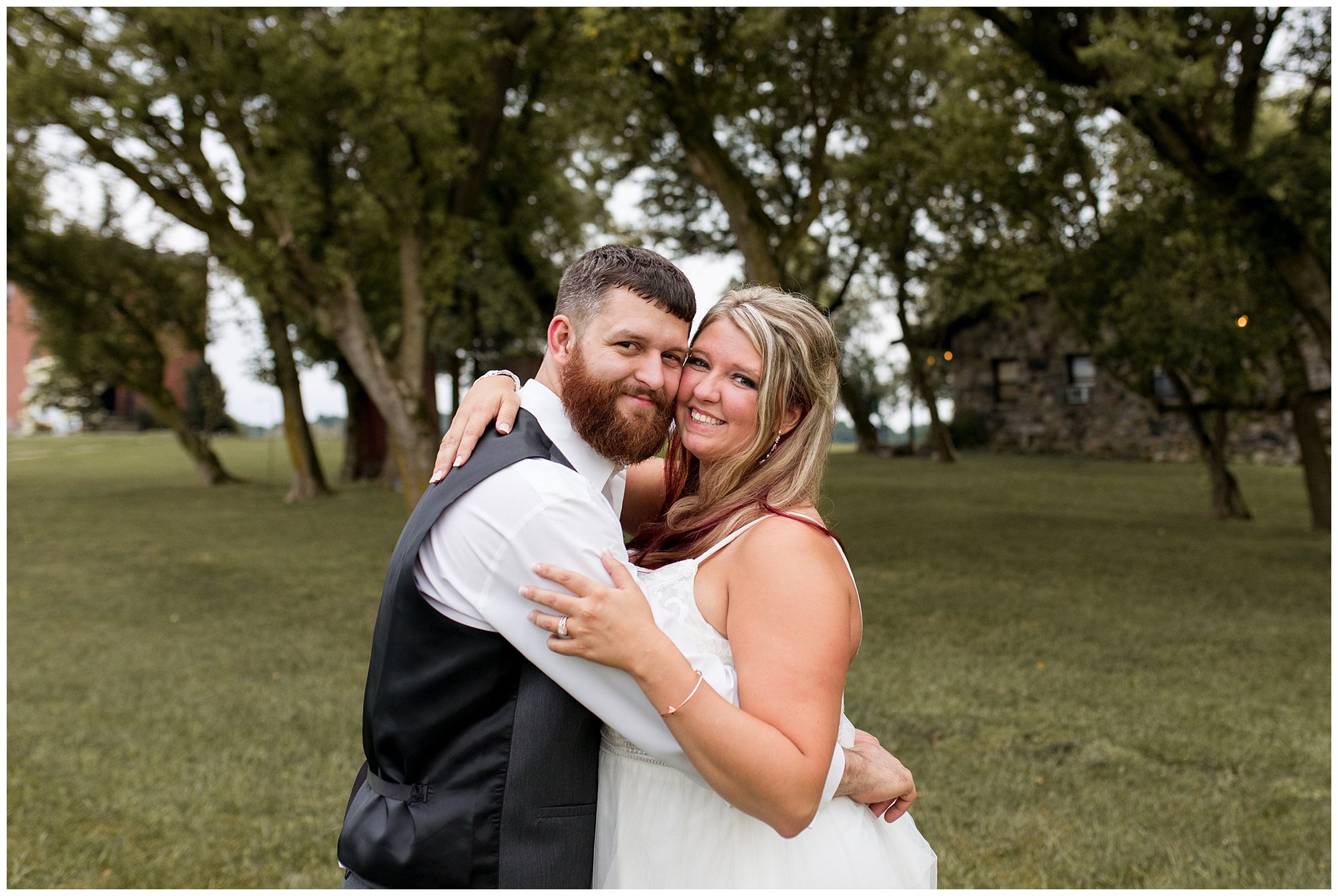 bride and groom portraits at The Old Mill Village at Fremont, Indiana