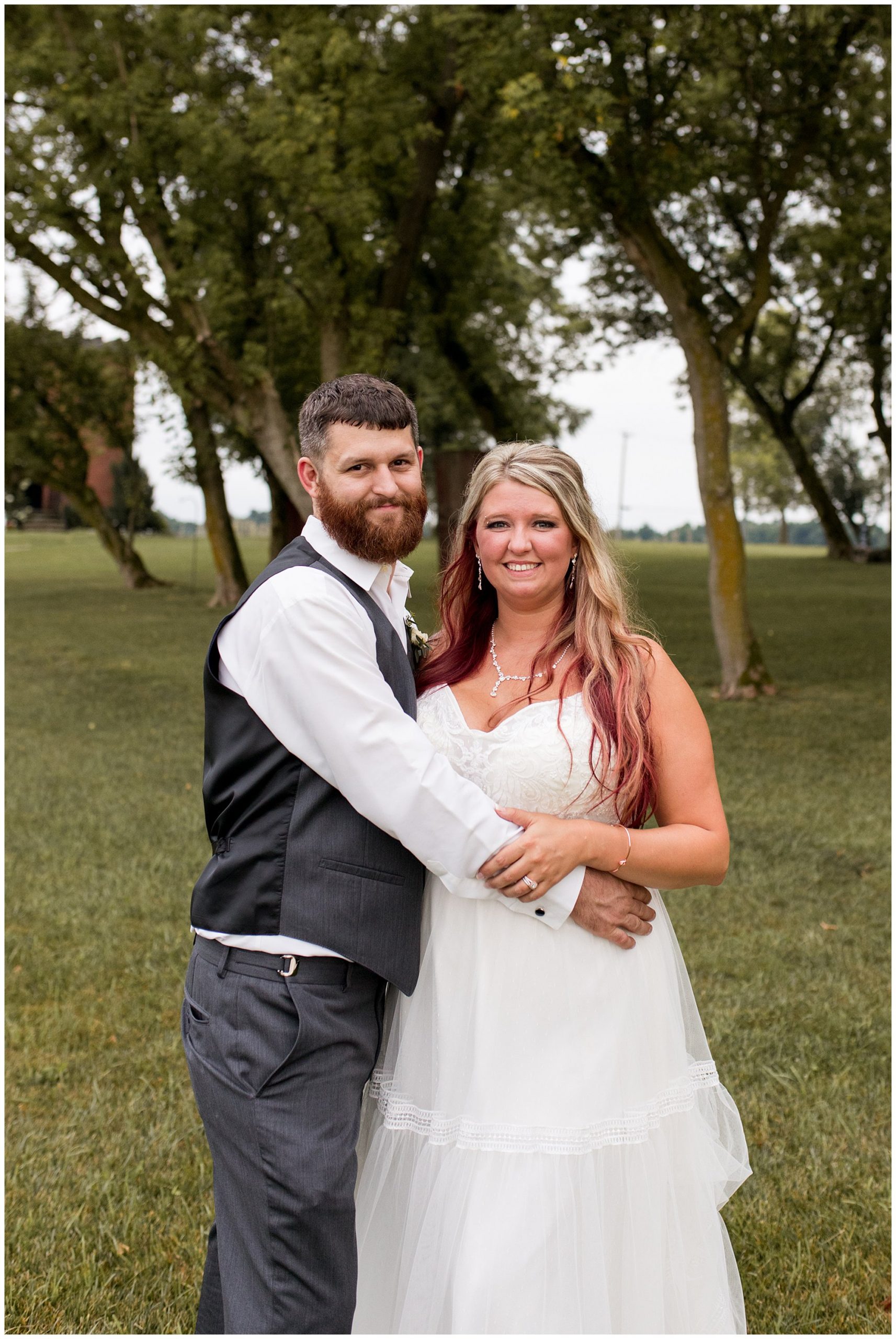 bride and groom portraits at The Old Mill Village at Fremont, Indiana
