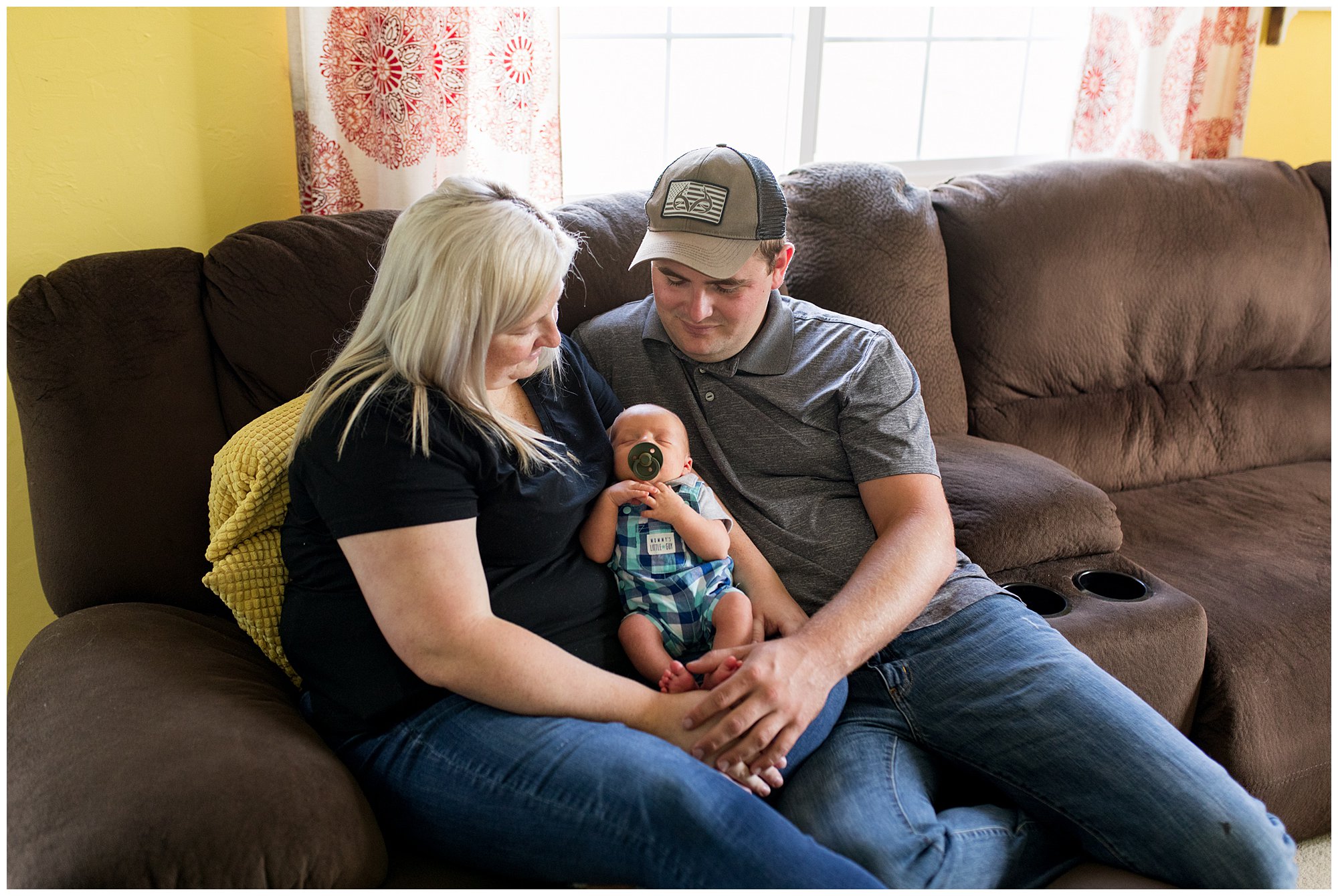 mom and dad hold baby during Muncie rustic newborn session